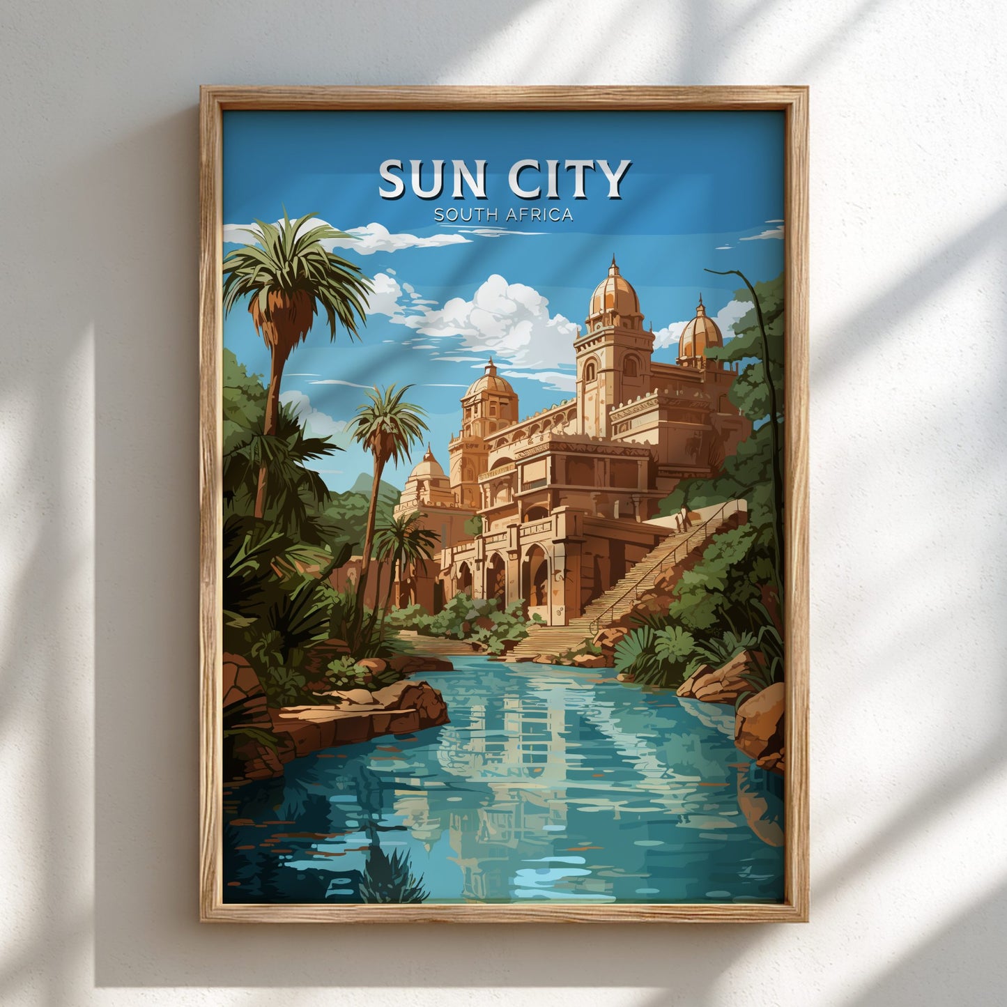Framed artwork of Sun City, South Africa with a building and pool.