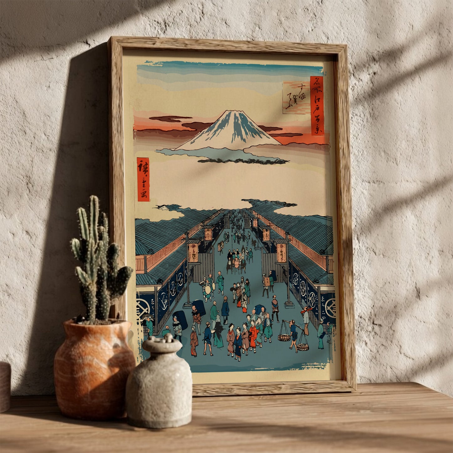 Famous art poster of Mount Fuji and a busy street scene in Japanese Ukiyo-e style.