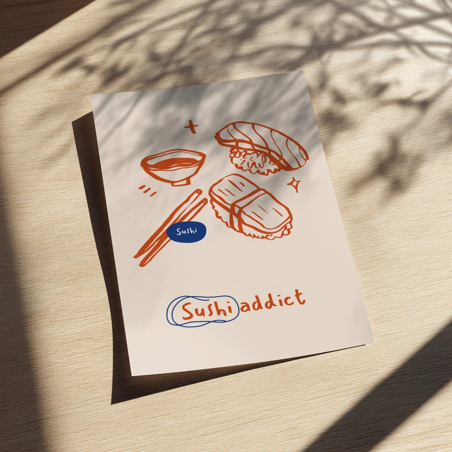 Framed artwork with sushi illustrations and 'Sushi addict' text on a light background