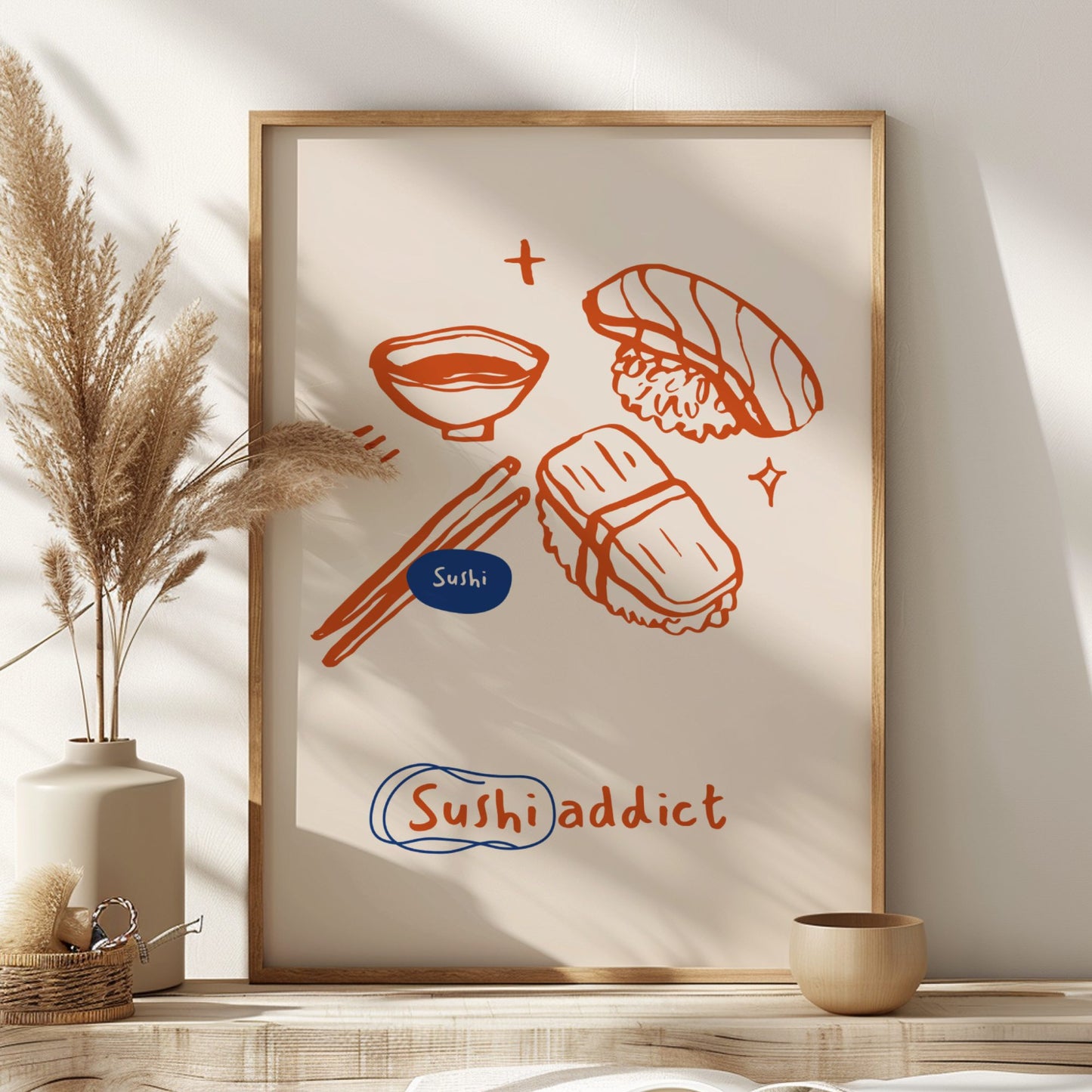 Framed artwork with sushi illustrations on a wall with decor elements.