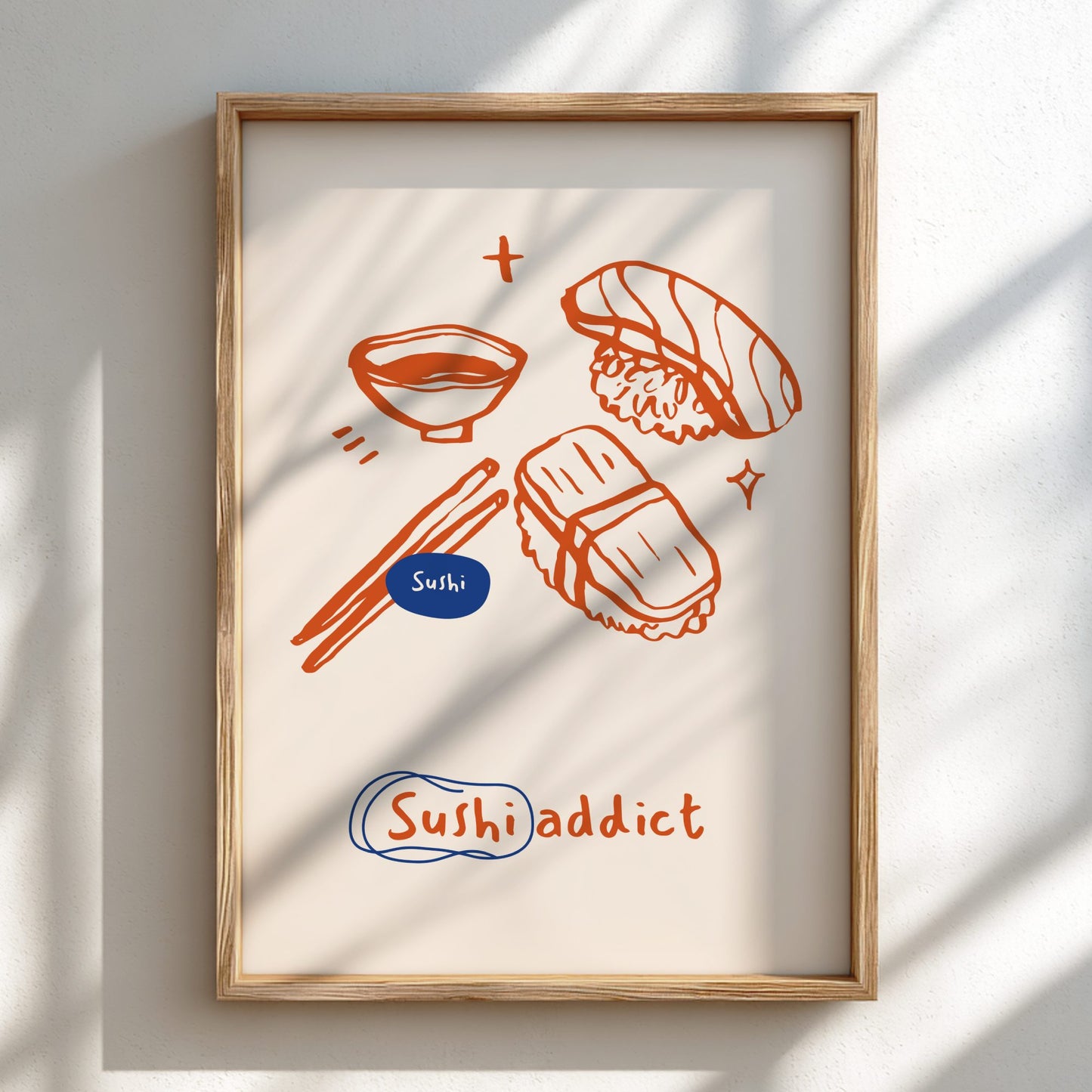 Framed artwork with sushi illustrations and 'Sushi addict' text on a light background