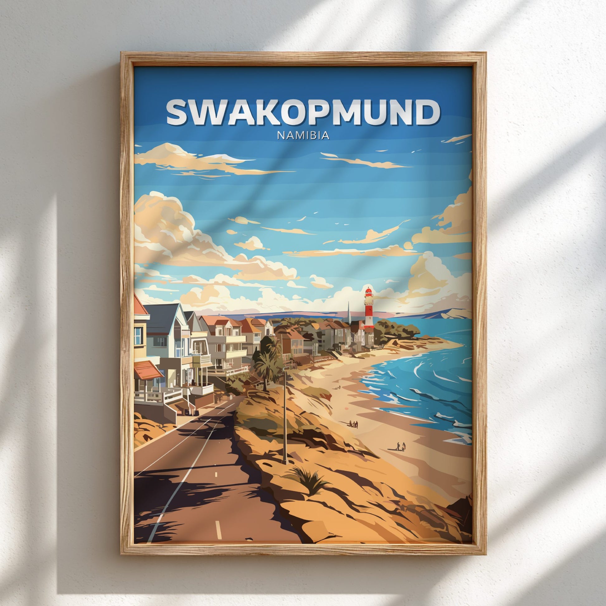 Framed artwork of Swakopmund, Namibia with a beach and lighthouse.