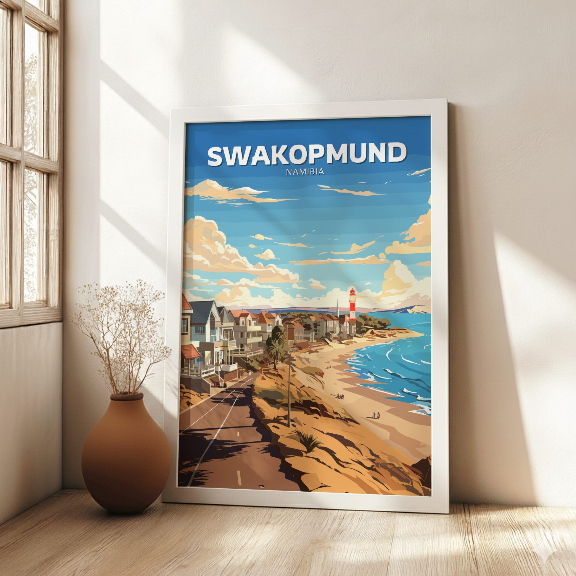 Framed poster of Swakopmund, Namibia with a beach scene on a wall.