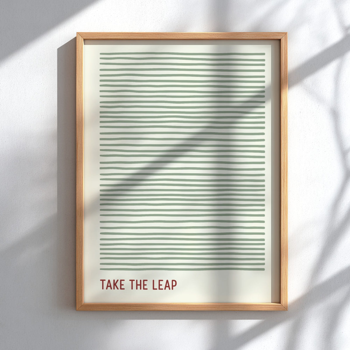 Motivational poster featuring soft sage green horizontal lines and the quote Take The Leap