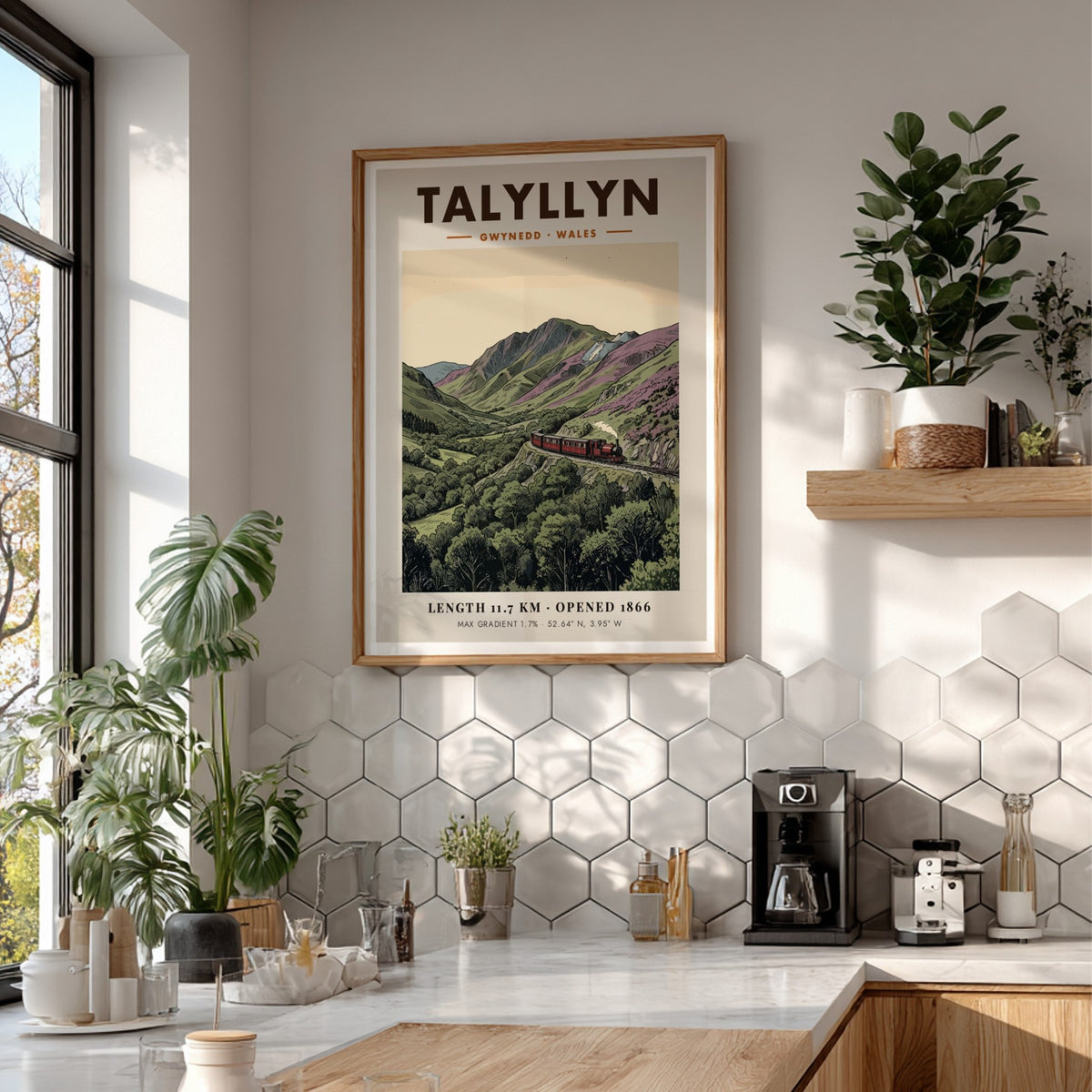 Poster of a red steam train travelling through the mountainous Talyllyn landscape in Wales.