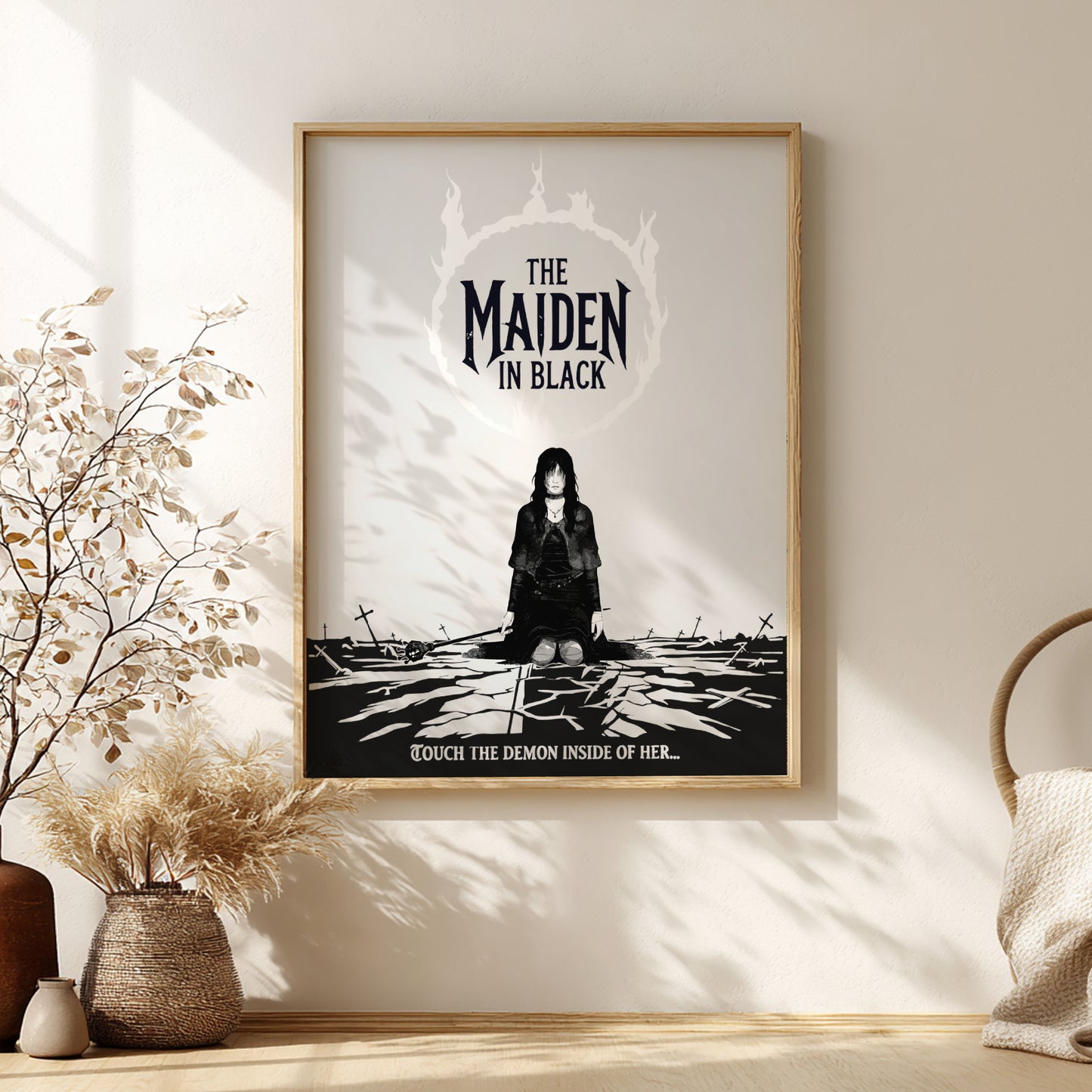Framed artwork of The Maiden in Black from Dark Souls on a wall with decorative elements.