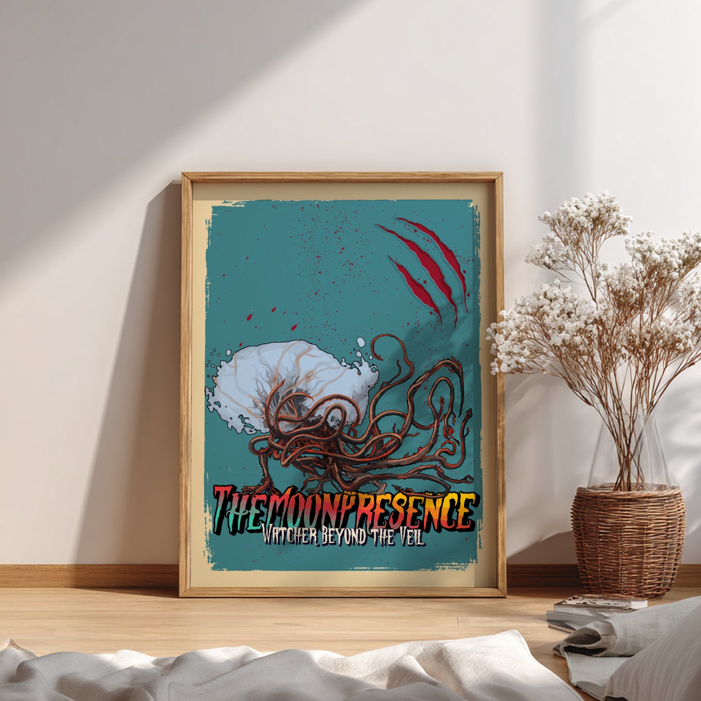 Framed artwork of The Moon Presence from Bloodborne on a wall with a plant in the background