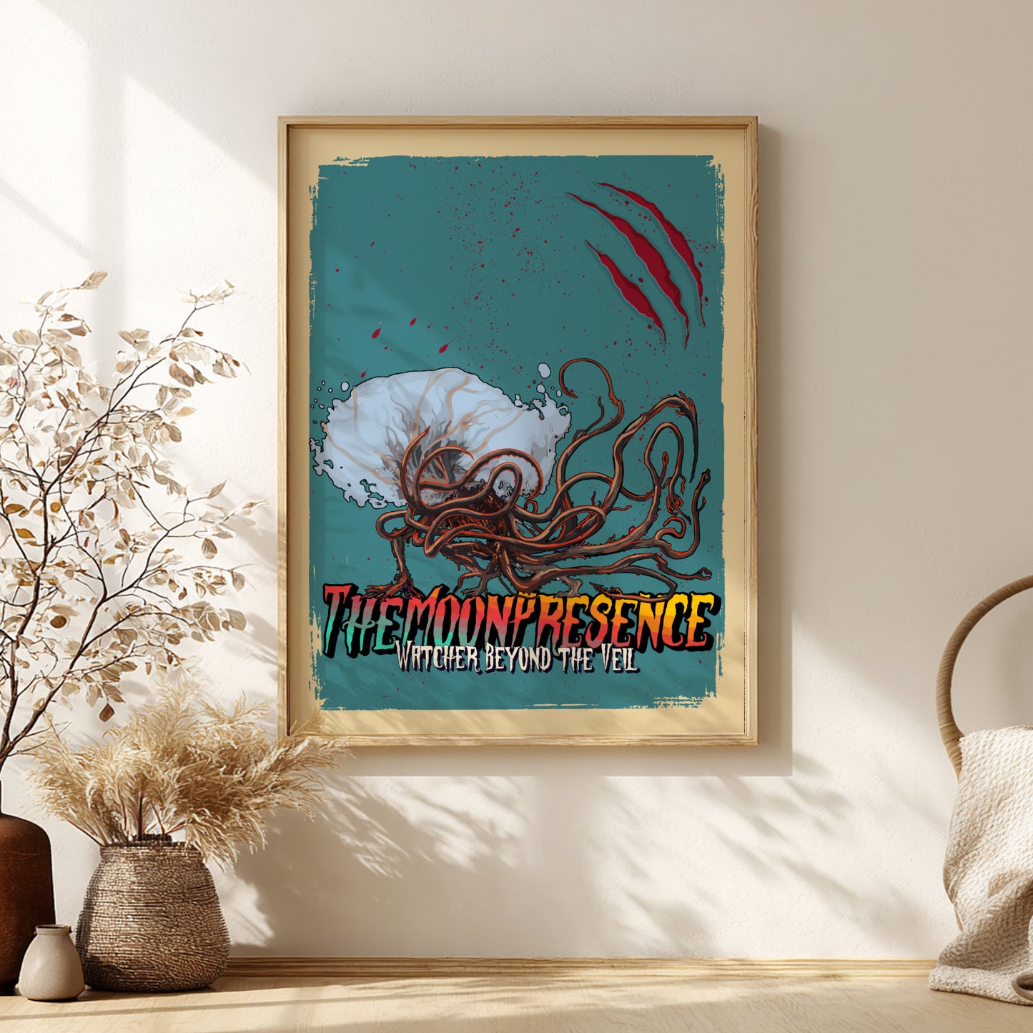 Framed artwork of The Moon Presence from Bloodborne on a teal background, displayed on a wall.