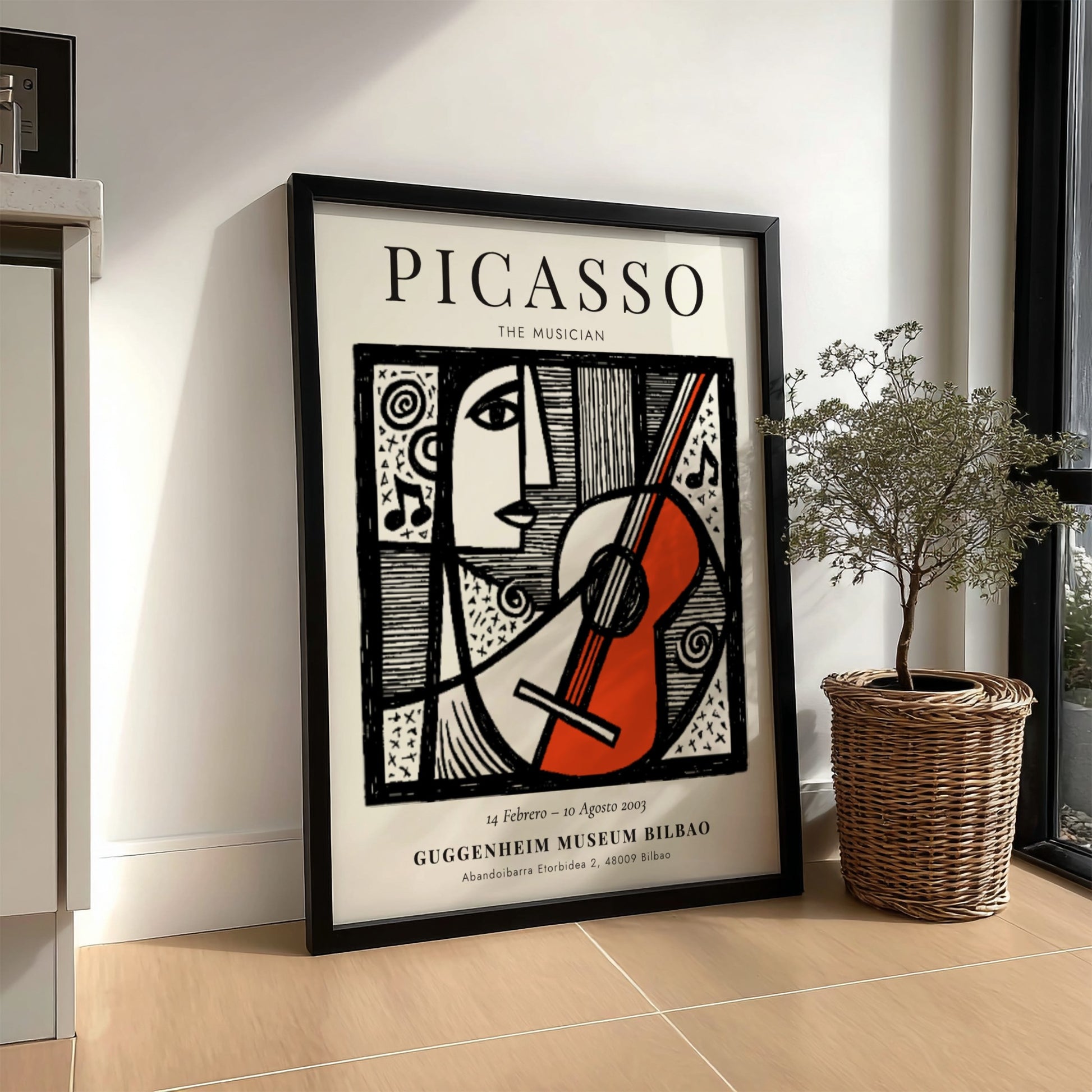 Picasso inspired poster featuring a musician with guitar in monochrome style