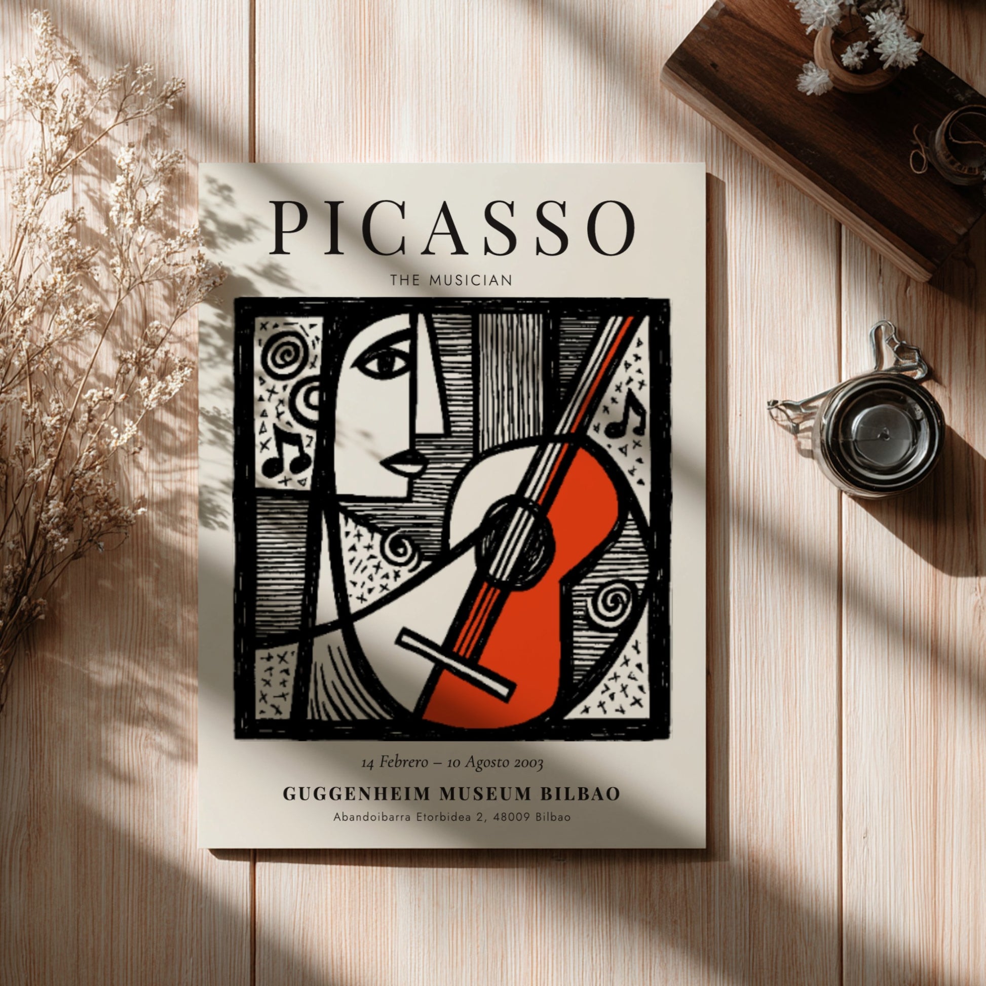 Picasso inspired poster featuring a musician with guitar in monochrome style