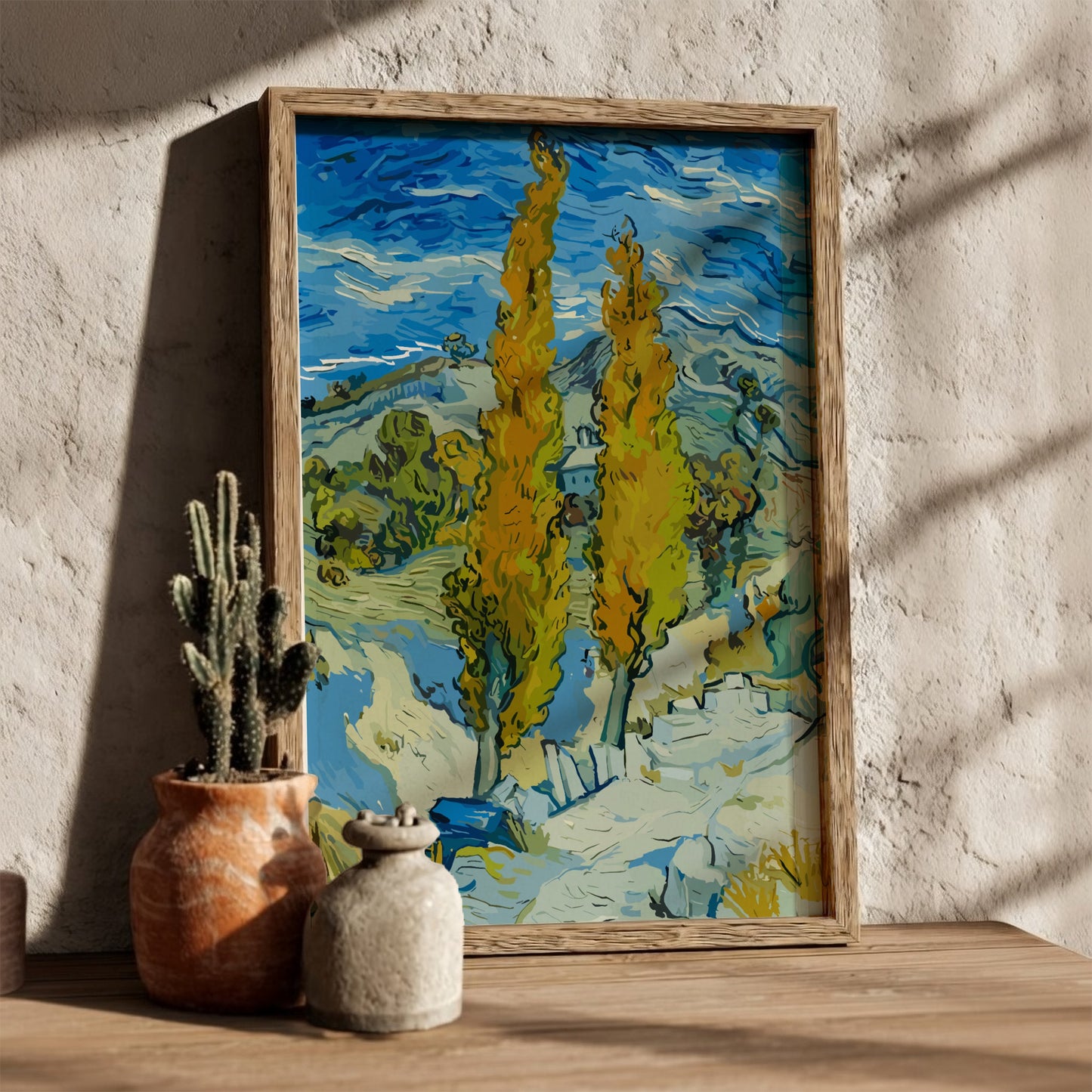Vincent Van Gogh's "The Poplars" art poster, featuring tall yellow trees and a blue sky.