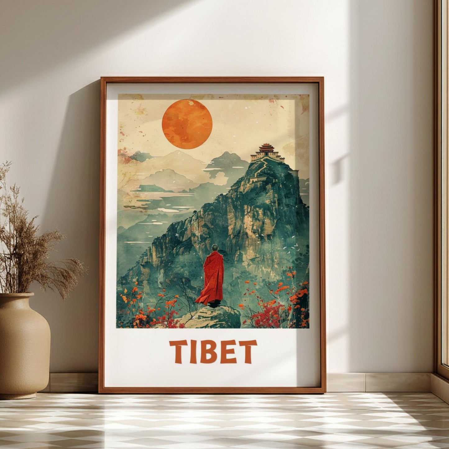 Framed artwork of a mountain scene with a person in red robes and 'TIBET' text on a wall.