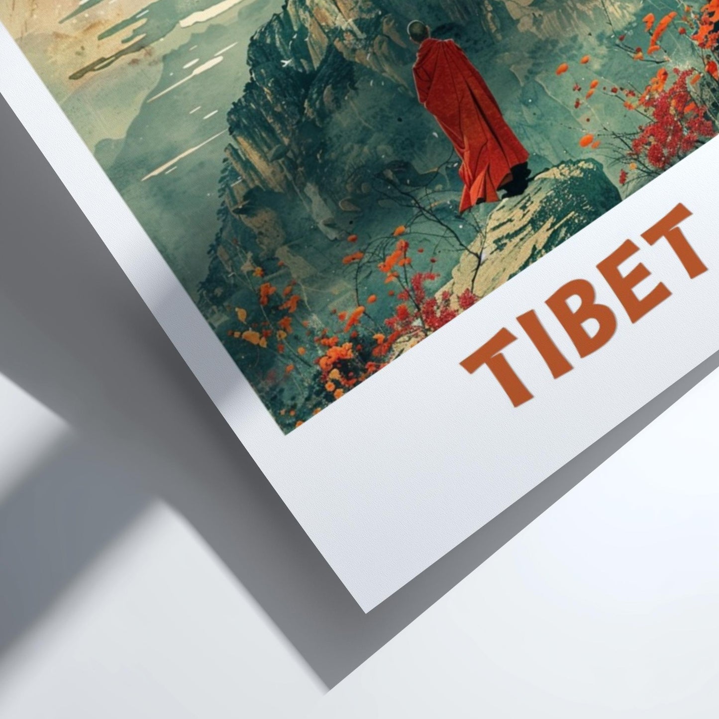 Framed artwork of a person in a red robe in a mountainous landscape with 'TIBET' text.