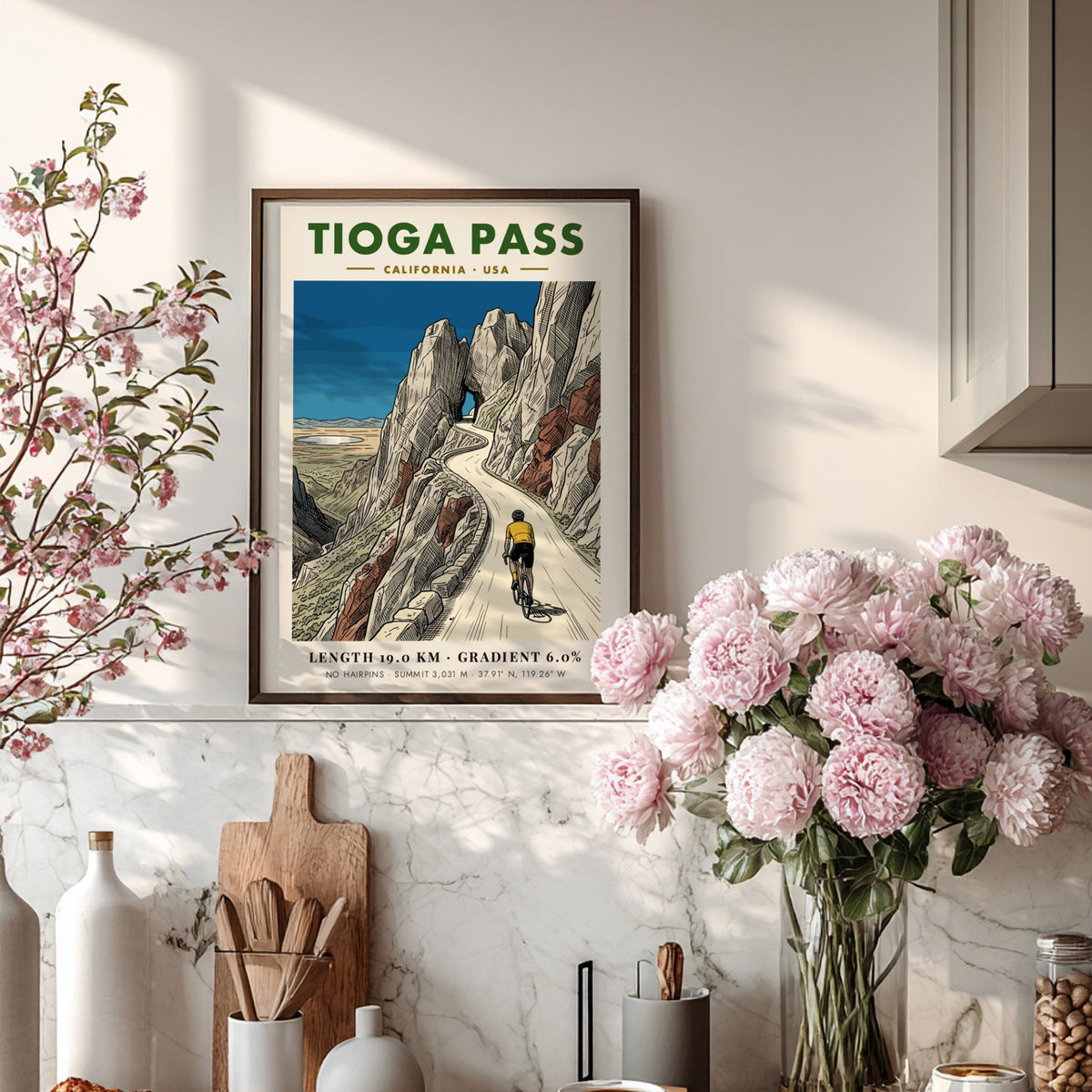 Poster of a cyclist climbing Tioga Pass with rocky mountains and blue sky.
