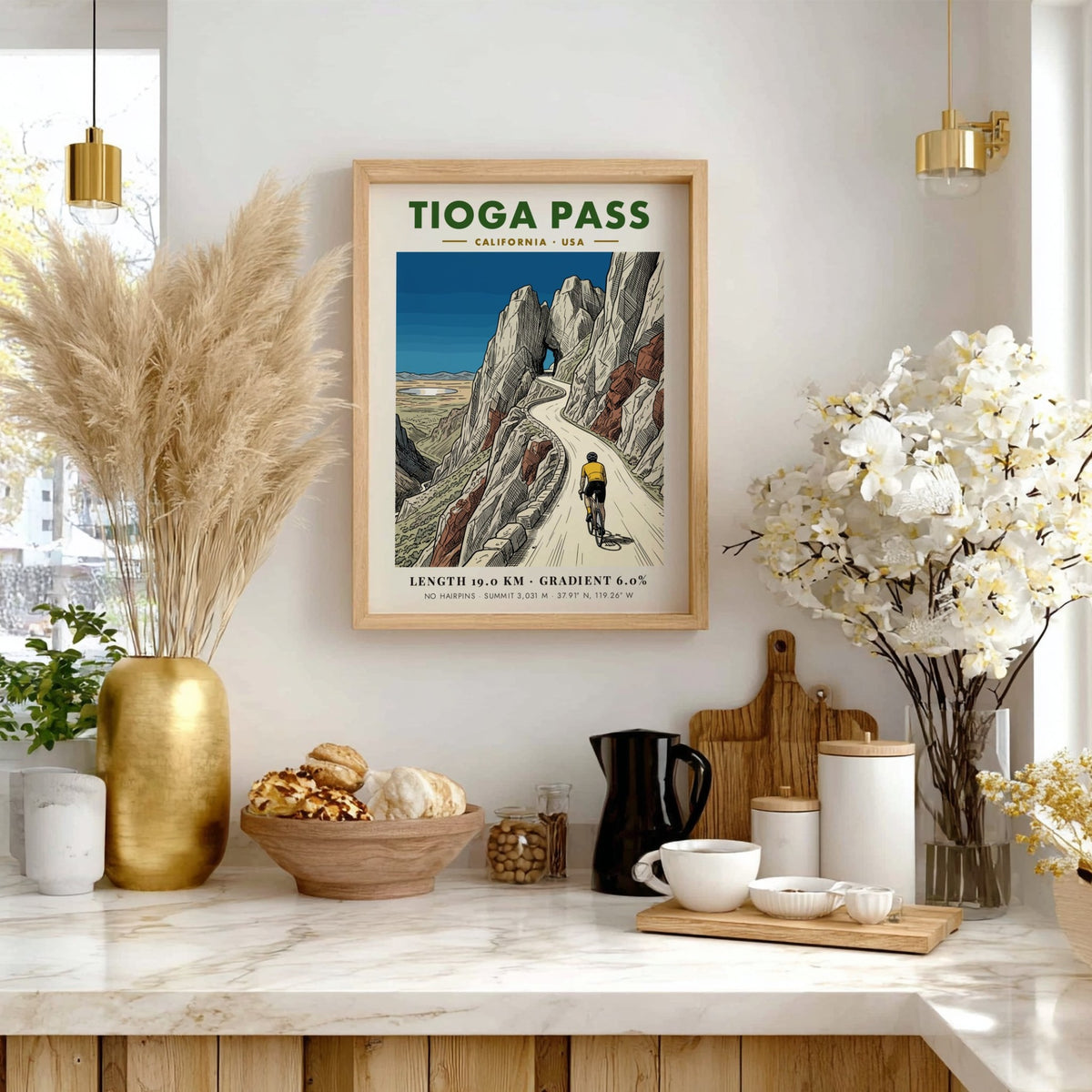Poster of a cyclist climbing Tioga Pass with rocky mountains and blue sky.