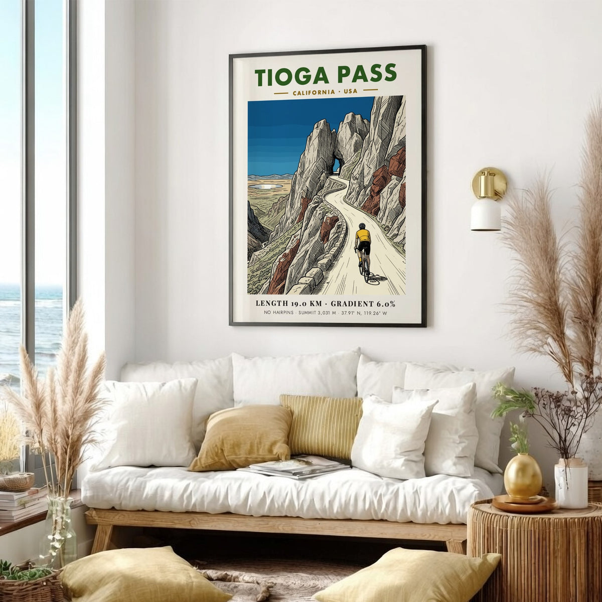 Poster of a cyclist climbing Tioga Pass with rocky mountains and blue sky.
