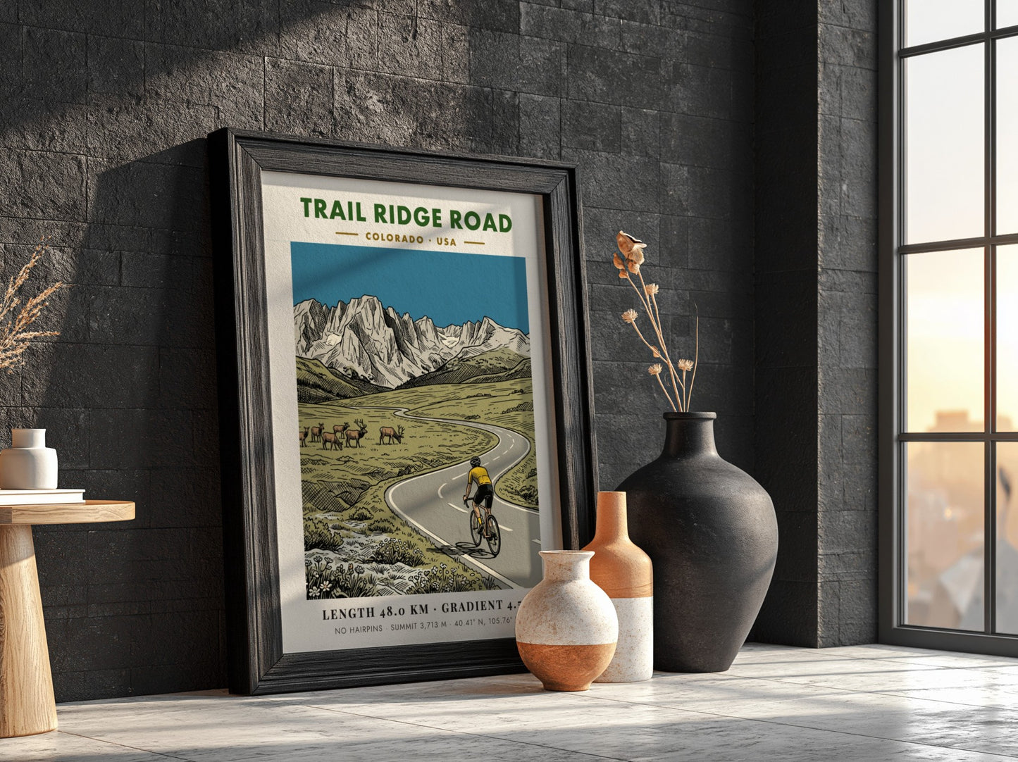 Poster of a cyclist on Trail Ridge Road with elk and mountains behind