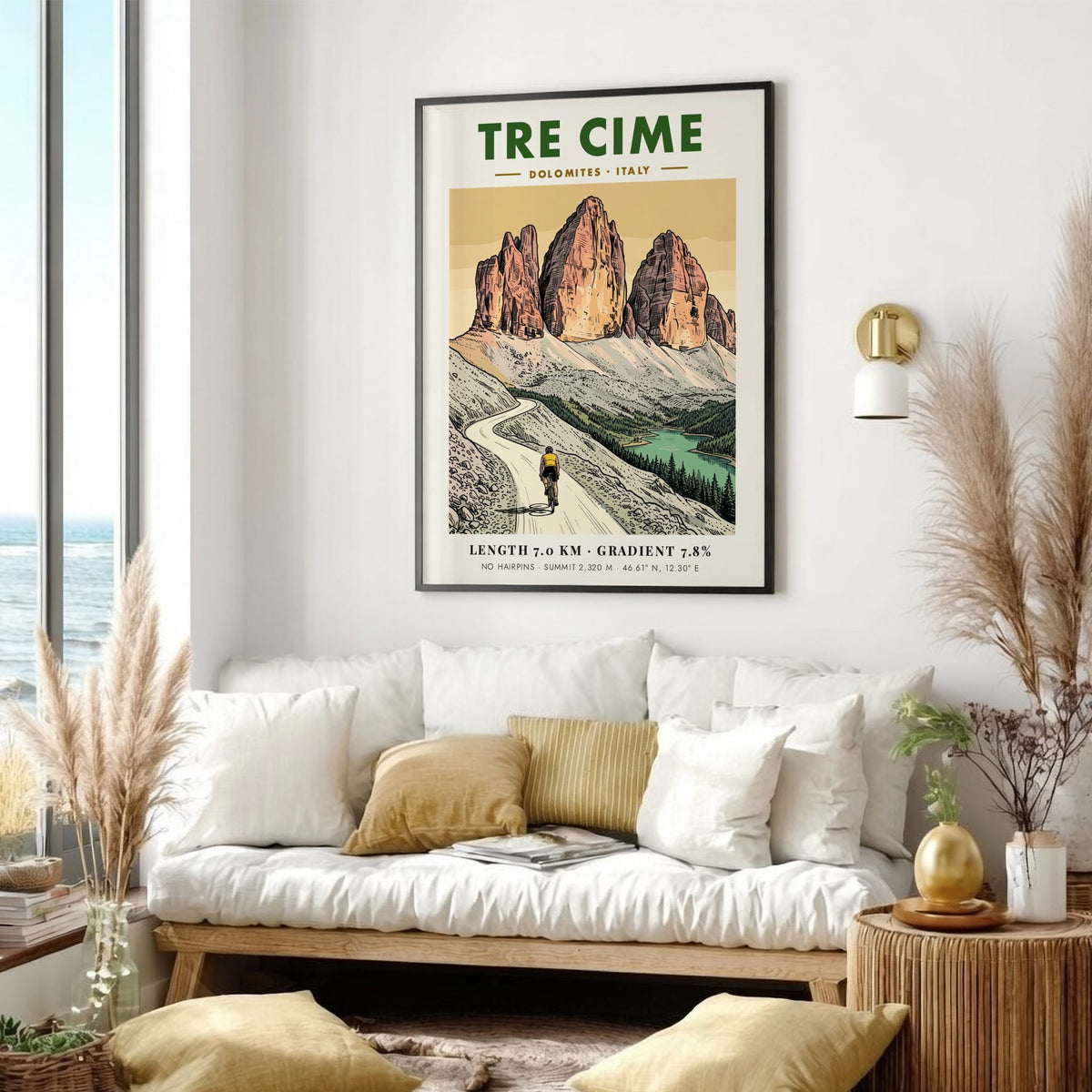 Poster of a lone cyclist riding through the jagged Tre Cime mountain peaks.