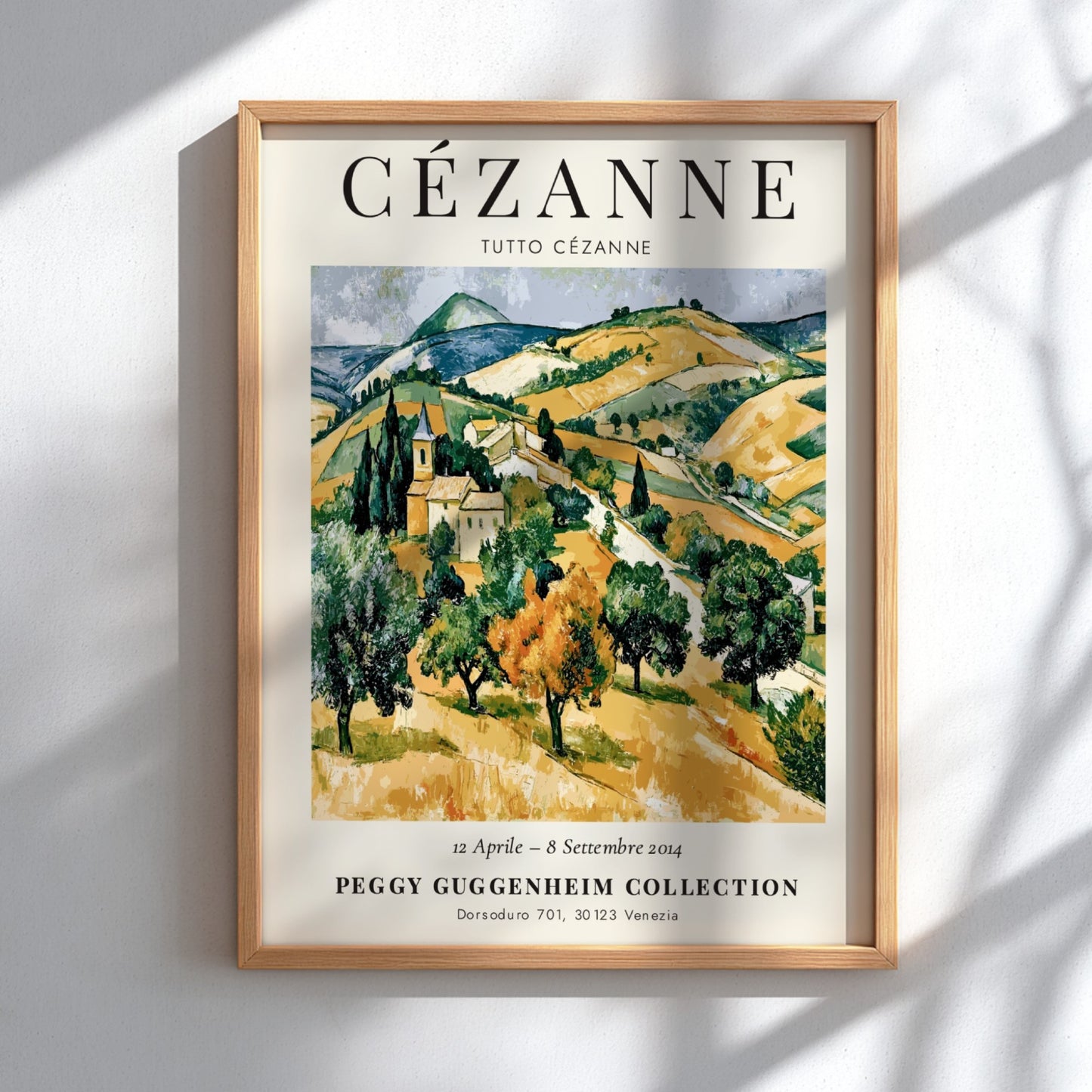 Cézanne exhibition poster featuring a vibrant landscape in green and gold tones