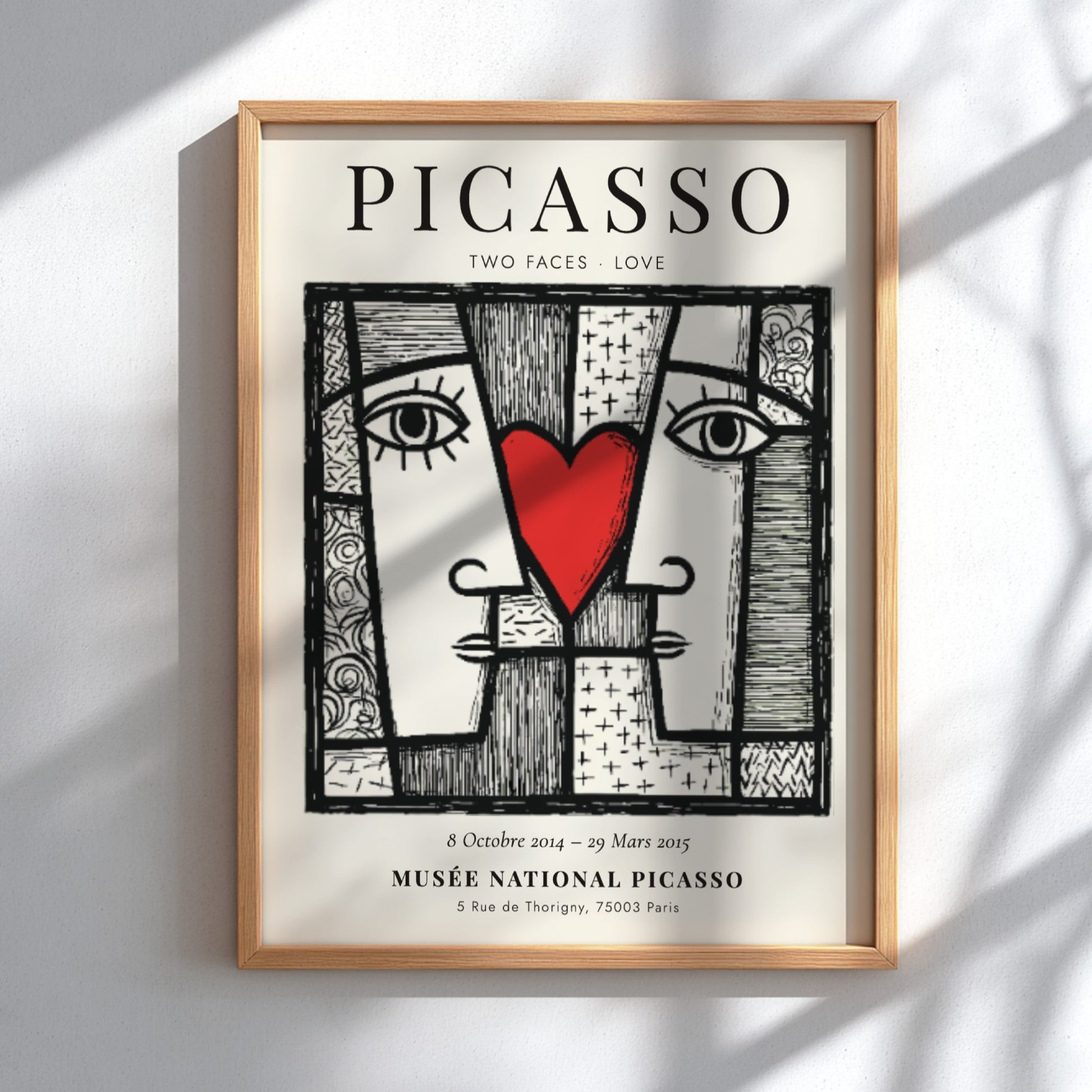 Picasso inspired poster featuring two abstract faces and a red heart, perfect for modern wall decor.