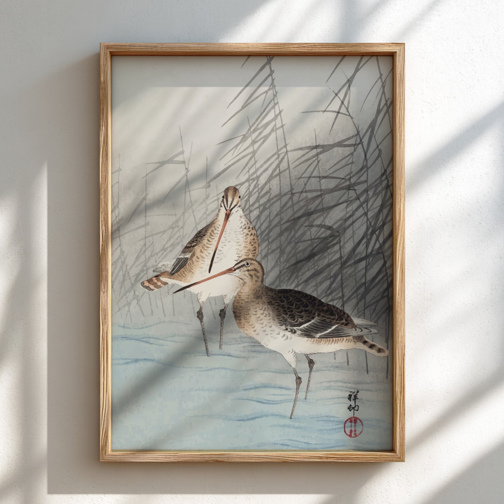 Poster of "Two Bar-Tailed Godwits" by Ohara Koson, featuring two birds in reeds, Japanese art style.