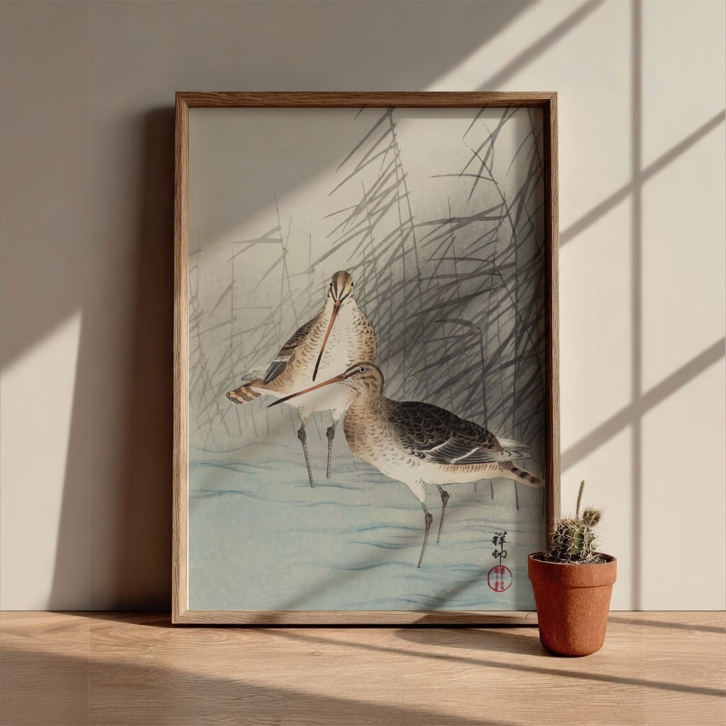 Poster of "Two Bar-Tailed Godwits" by Ohara Koson, featuring two birds in reeds, Japanese art style.
