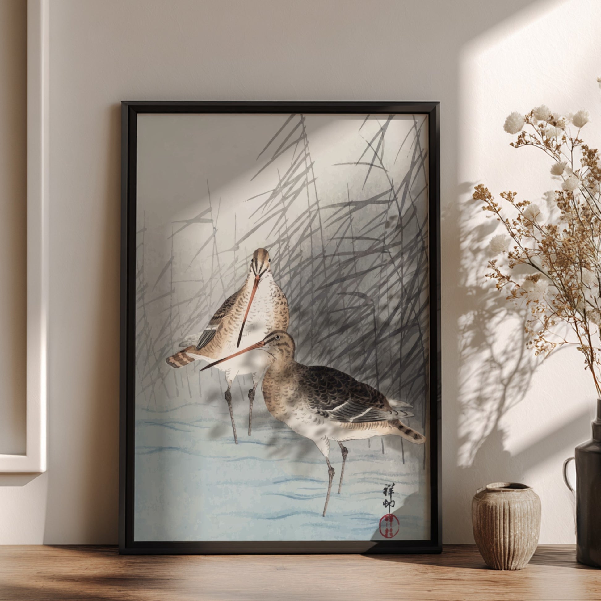 Poster of "Two Bar-Tailed Godwits" by Ohara Koson, featuring two birds in reeds, Japanese art style.