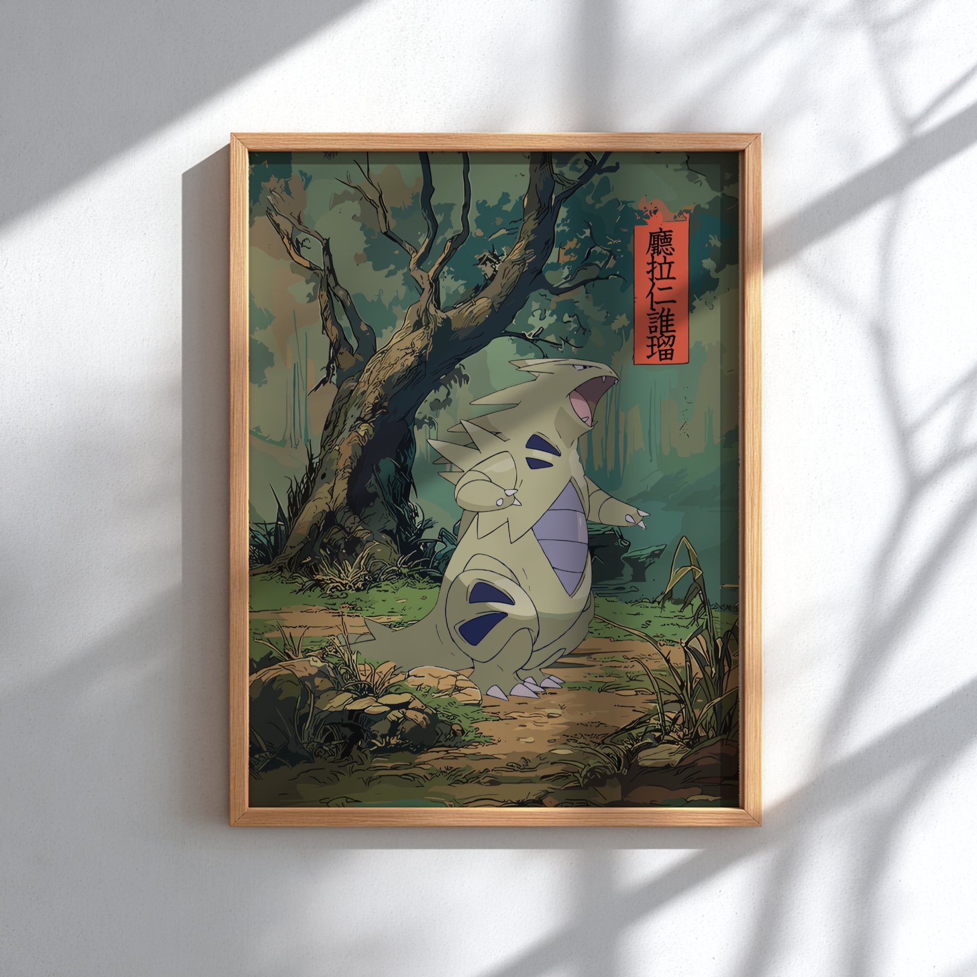 Framed artwork of Tyranitar Pokemon in a forest setting on a white wall.