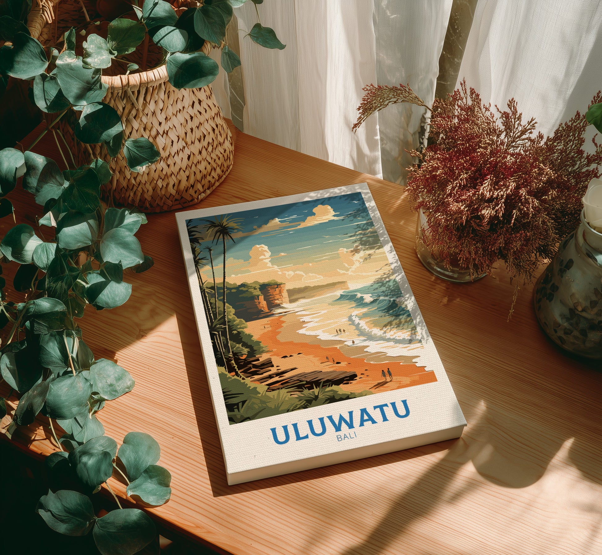 Canvas 'ULUWATU BALI' on a wooden table with plants around