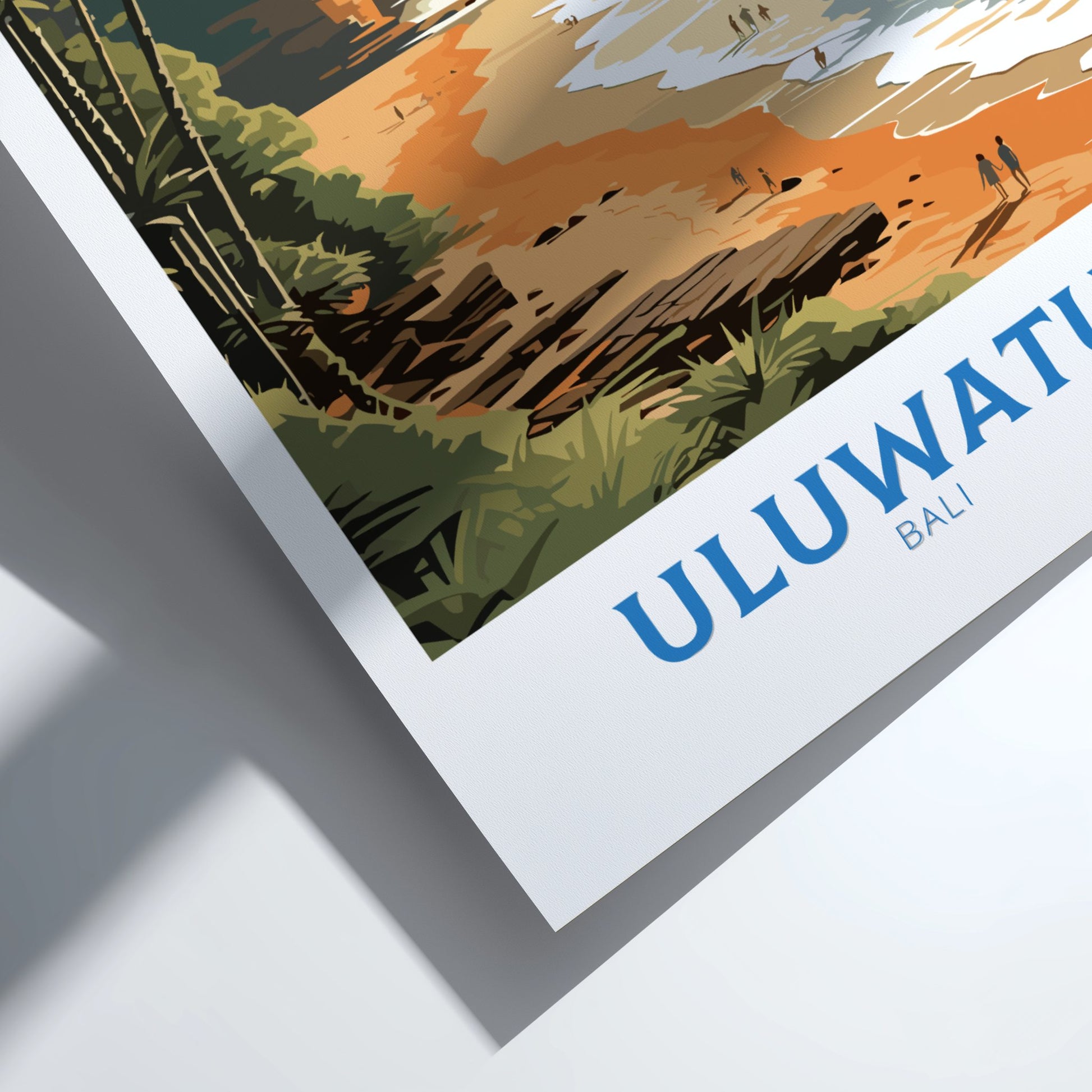 Framed artwork with 'ULUWATU BALI' text and scenic depiction of a beach and palm trees.