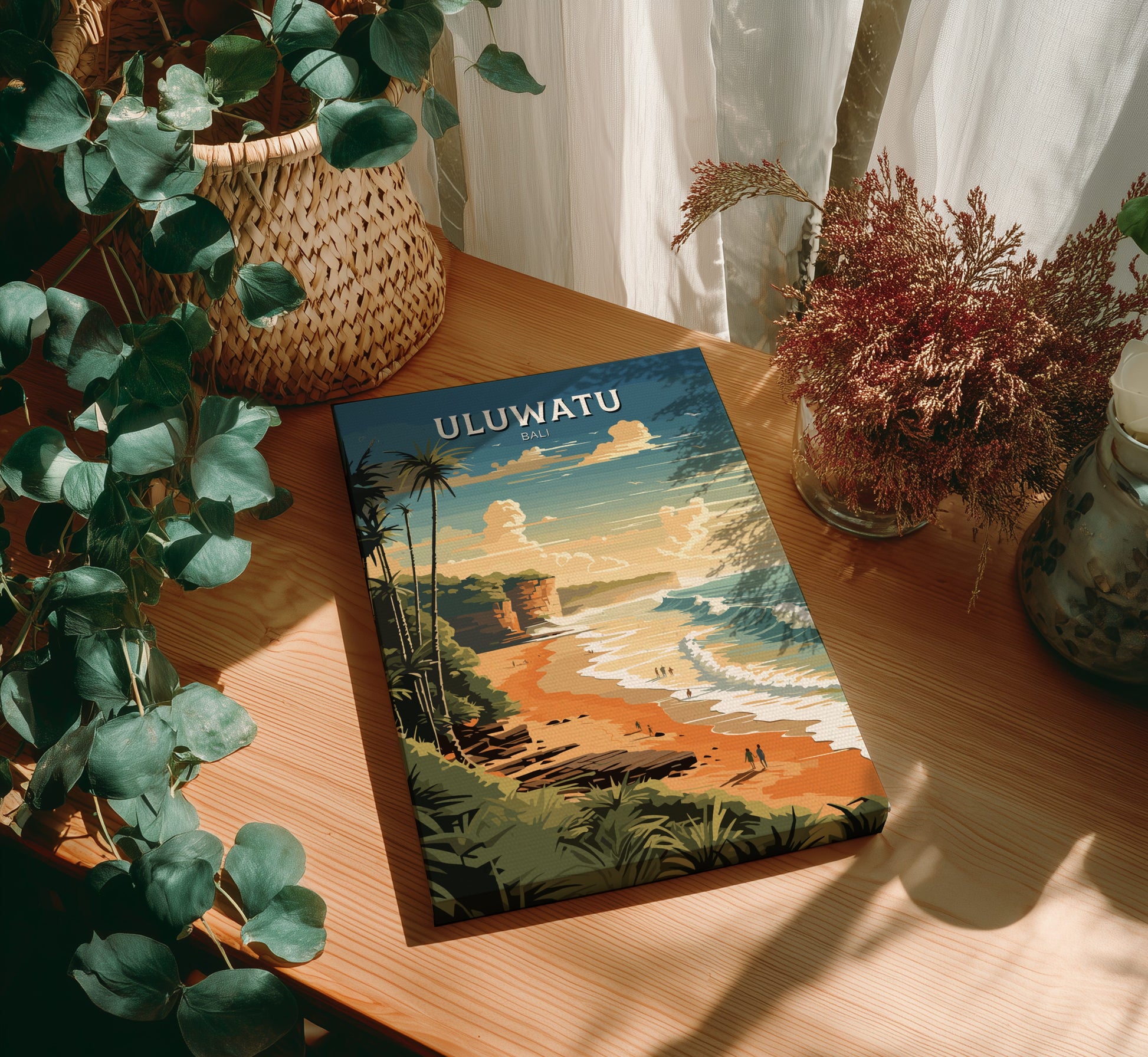 Book titled 'ULUWATU' on a wooden surface with plants around