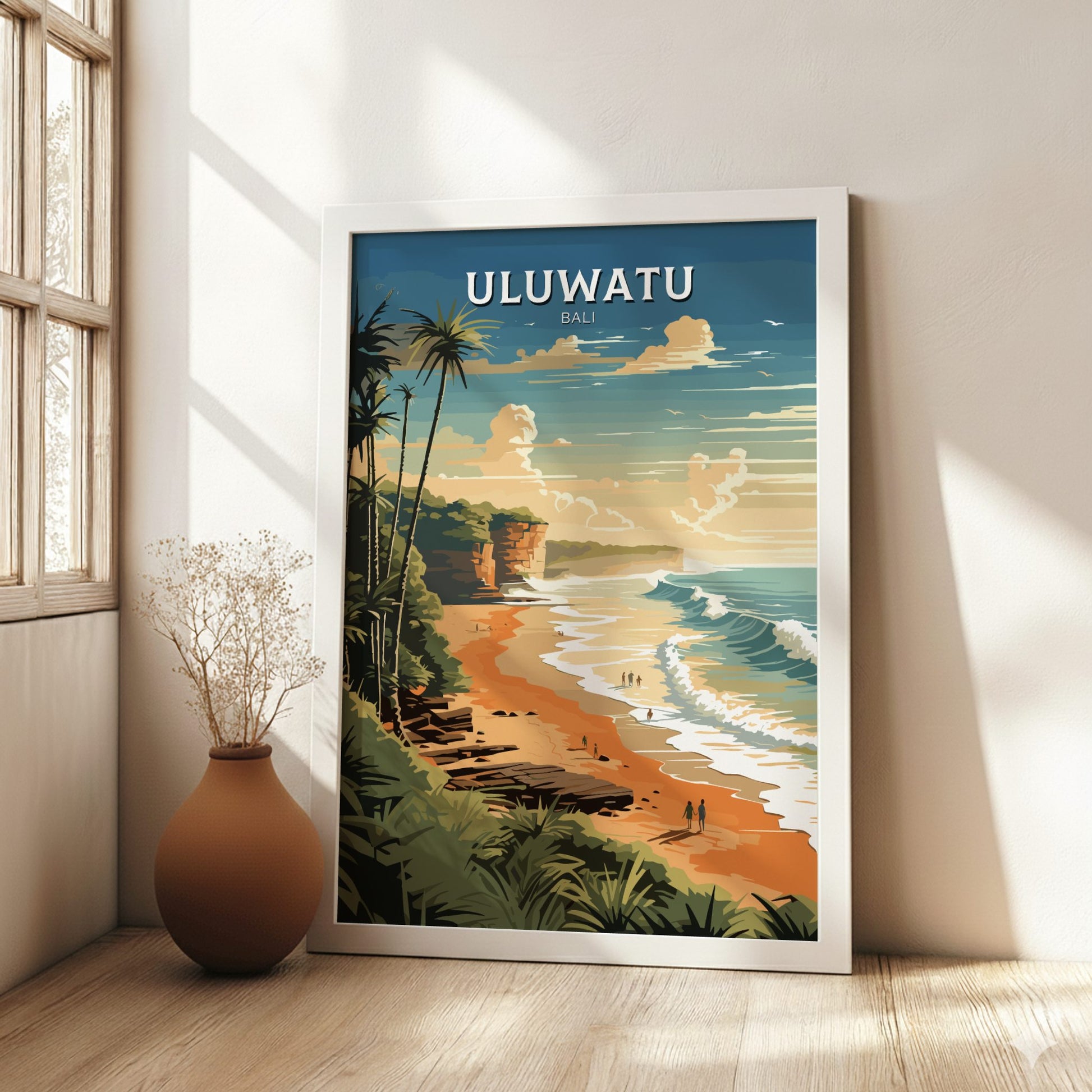 Framed poster of Uluwatu, Bali with a beach scene on a wall in a bright room.