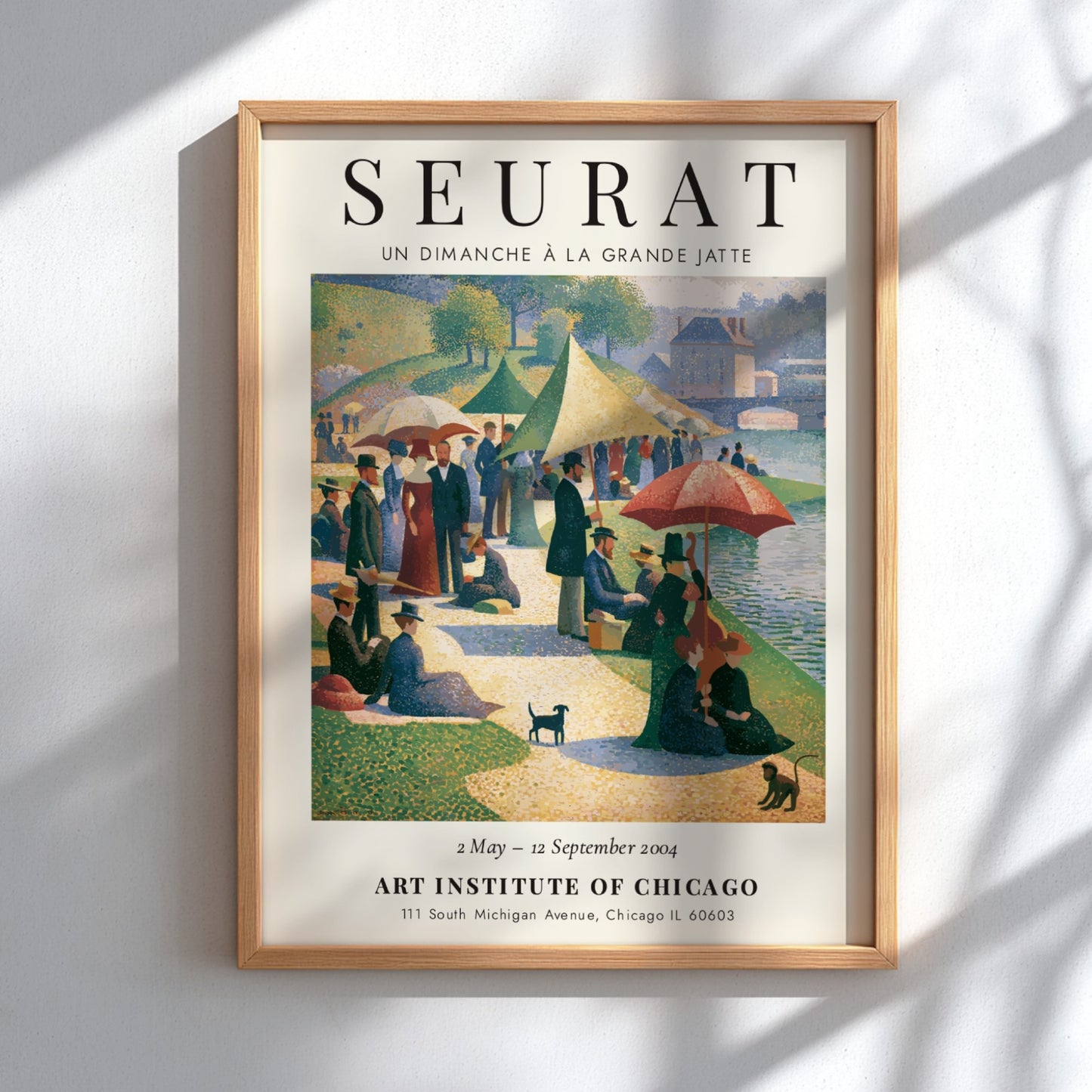 Seurat exhibition poster featuring Un Dimanche à la Grande Jatte with vibrant colors and serene picnic scene