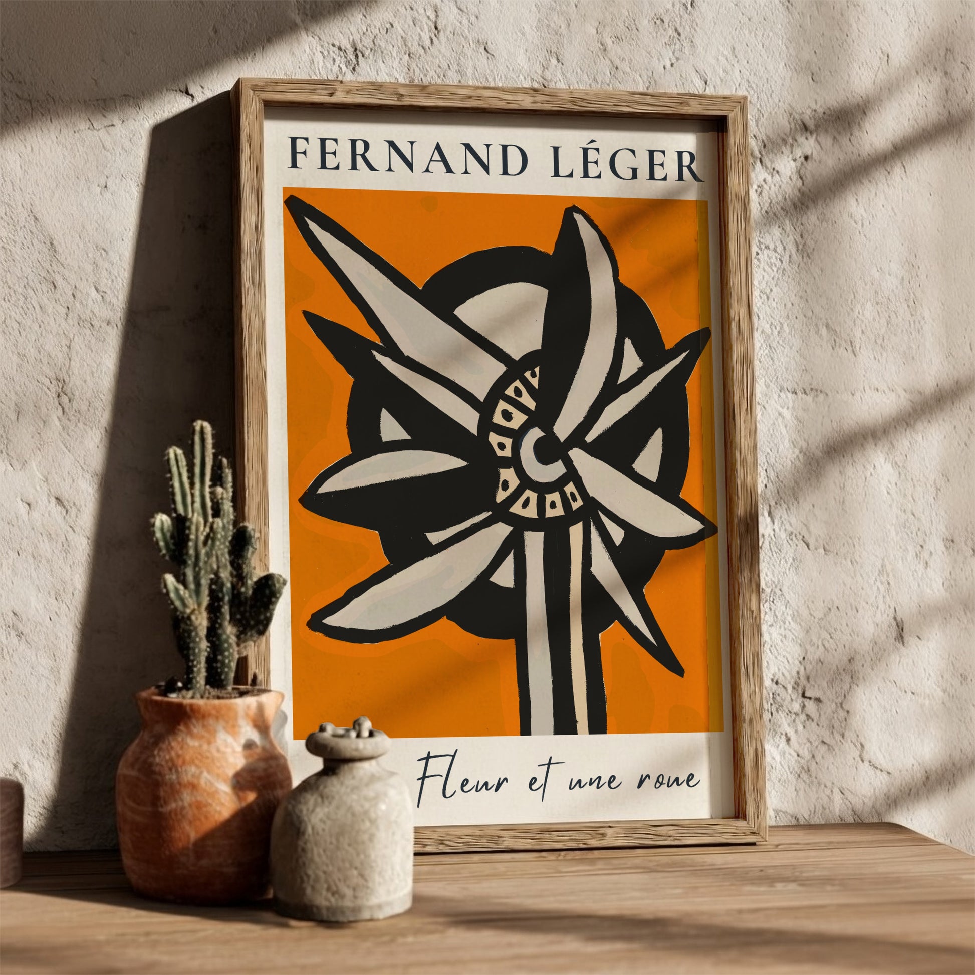 Fernand Léger "Une Fleur et une roue" poster with abstract flower/wheel design on orange background.