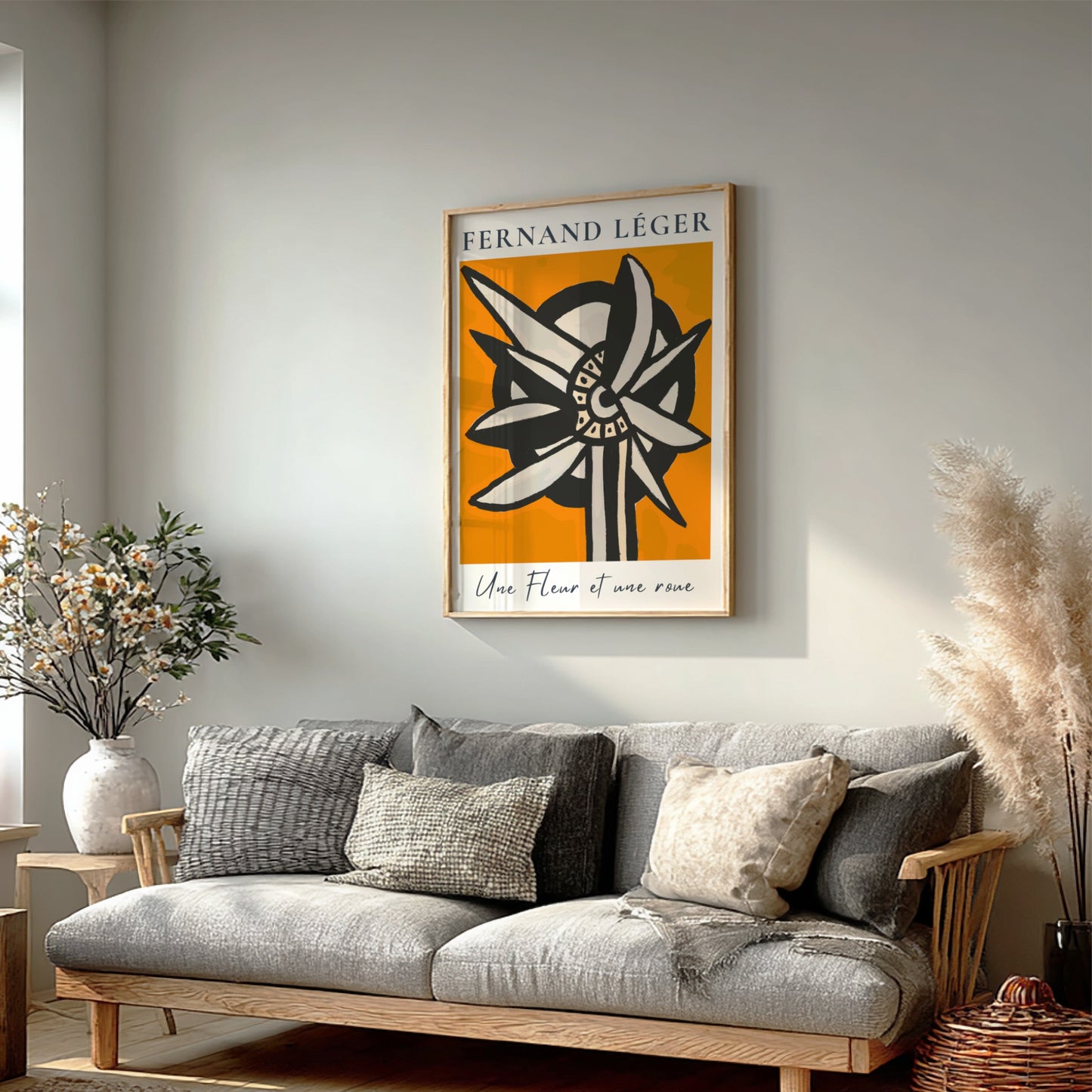 Fernand Léger "Une Fleur et une roue" poster with abstract flower/wheel design on orange background.