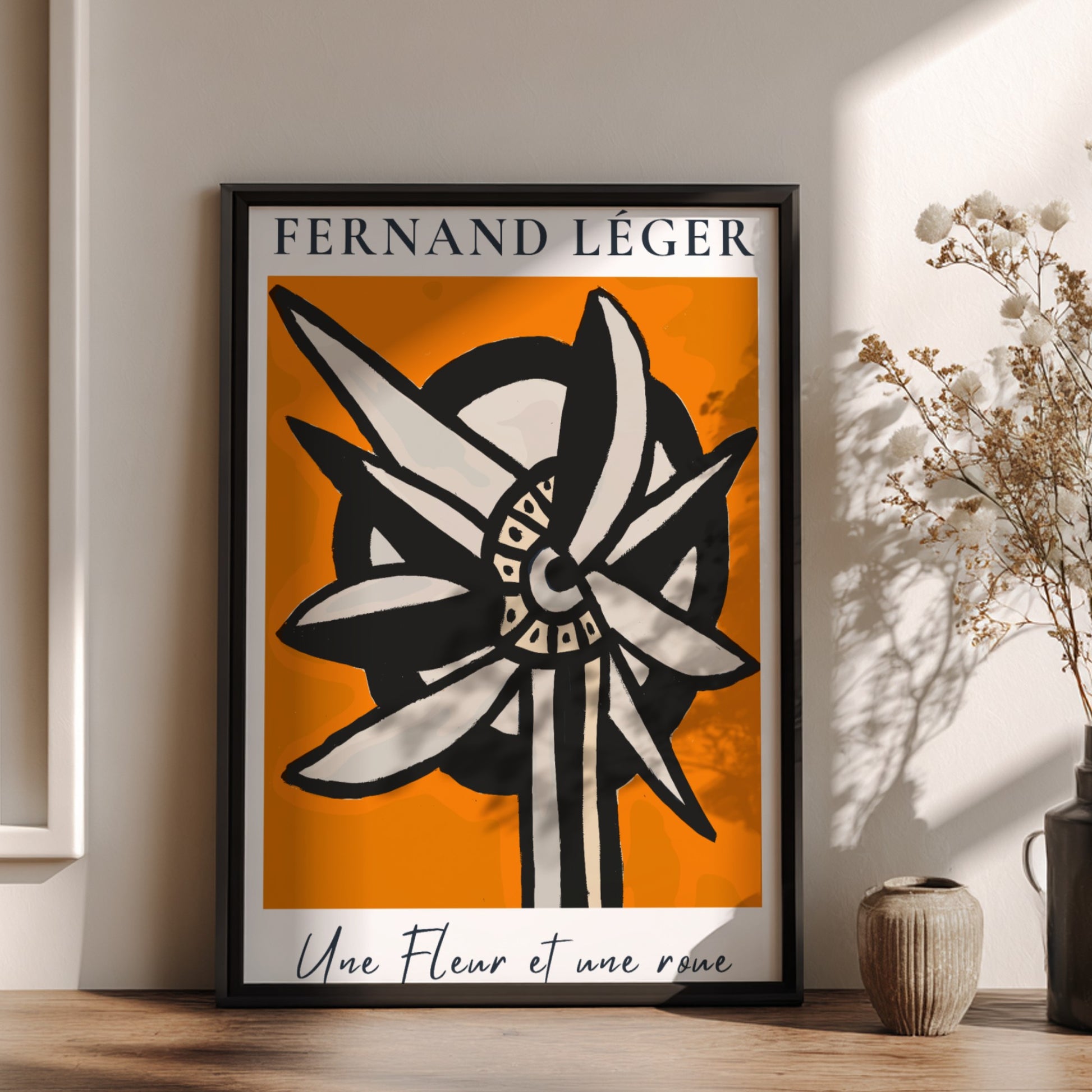 Fernand Léger "Une Fleur et une roue" poster with abstract flower/wheel design on orange background.