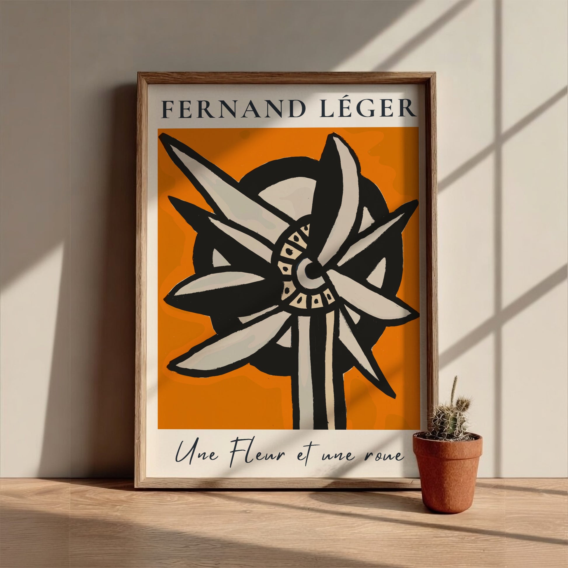 Fernand Léger "Une Fleur et une roue" poster with abstract flower/wheel design on orange background.