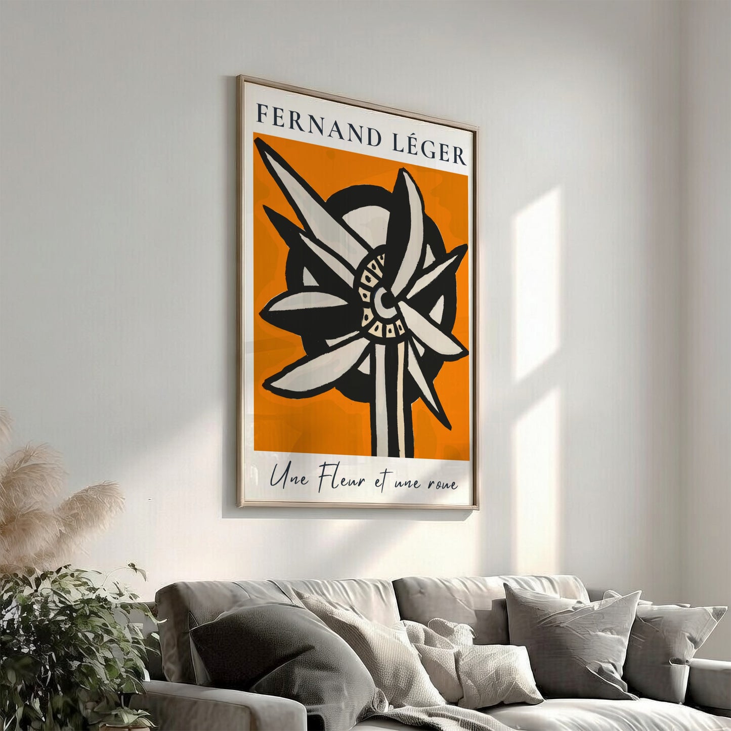 Fernand Léger "Une Fleur et une roue" poster with abstract flower/wheel design on orange background.