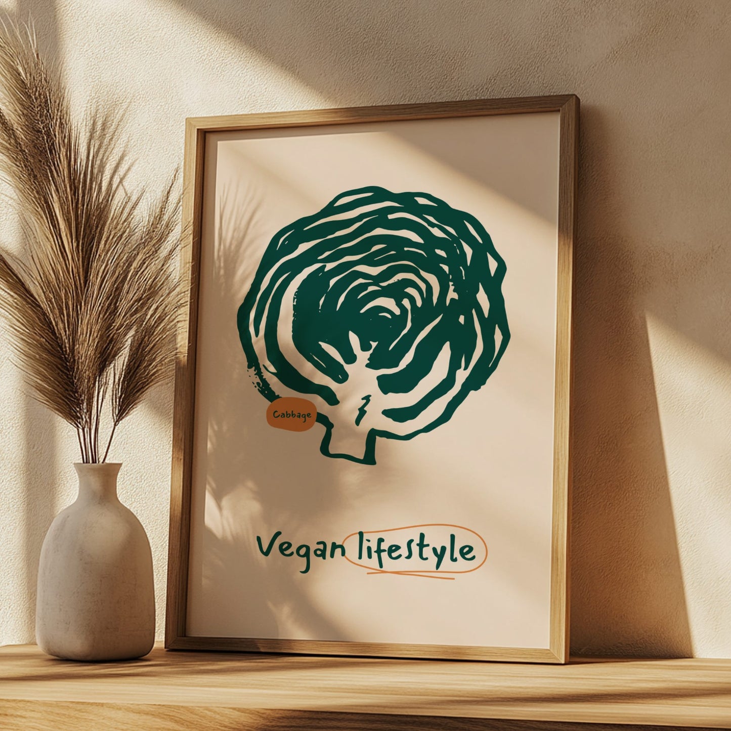 Framed artwork of a brussels sprout with 'Vegan lifestyle' text on a wooden shelf.