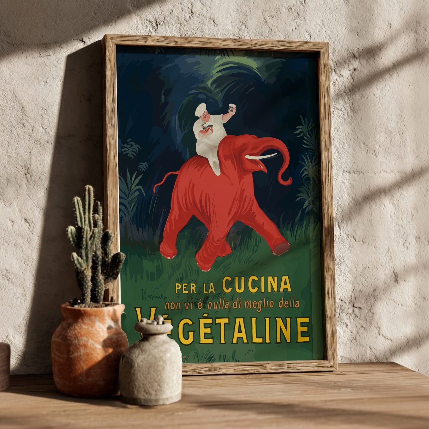 Vintage Vegetaline poster by Leonetto Cappiello featuring a chef on a red elephant. Art Nouveau style.