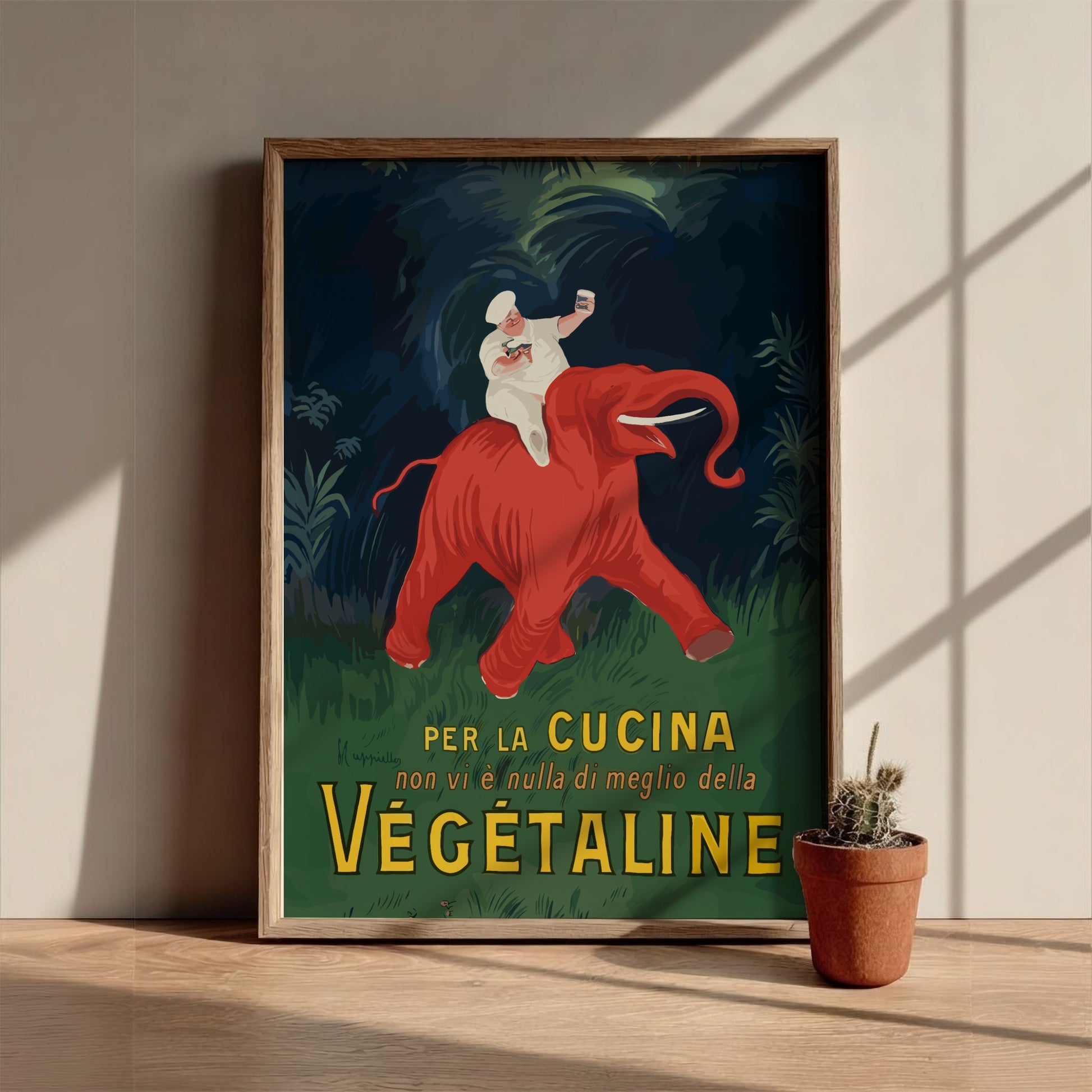 Vintage Vegetaline poster by Leonetto Cappiello featuring a chef on a red elephant. Art Nouveau style.