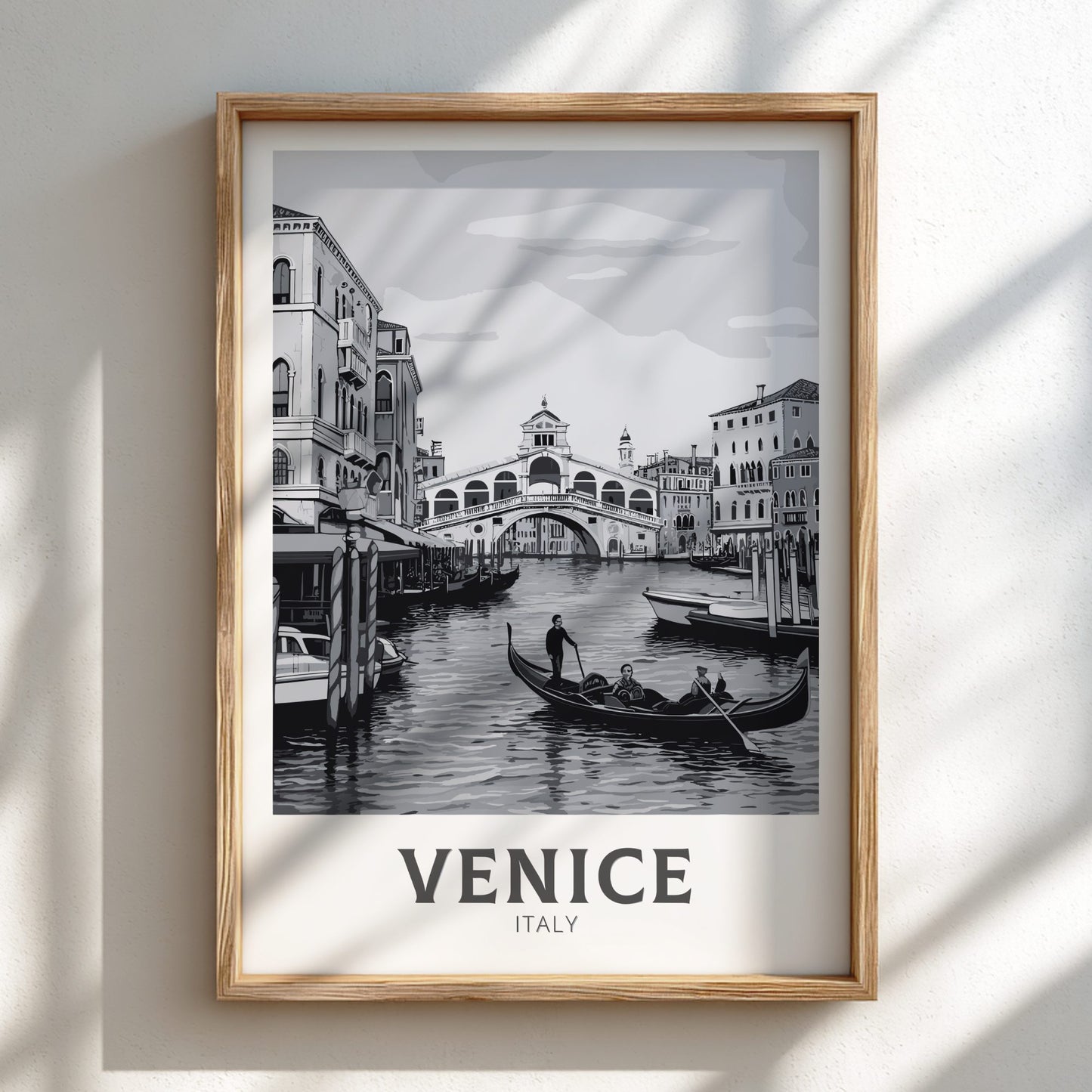 Venice black and white travel poster on a natural oak frame