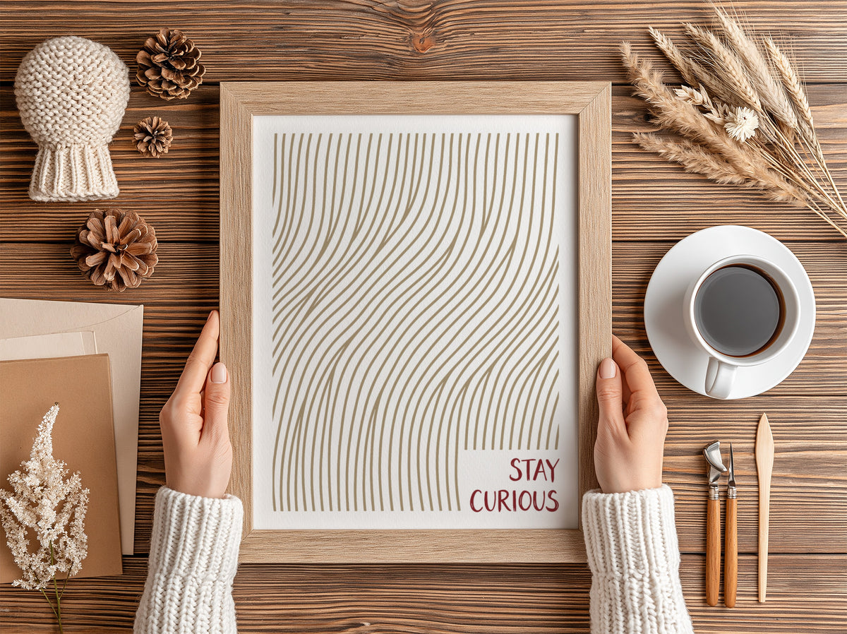 Motivational poster with golden wavy lines and the text Stay Curious in red