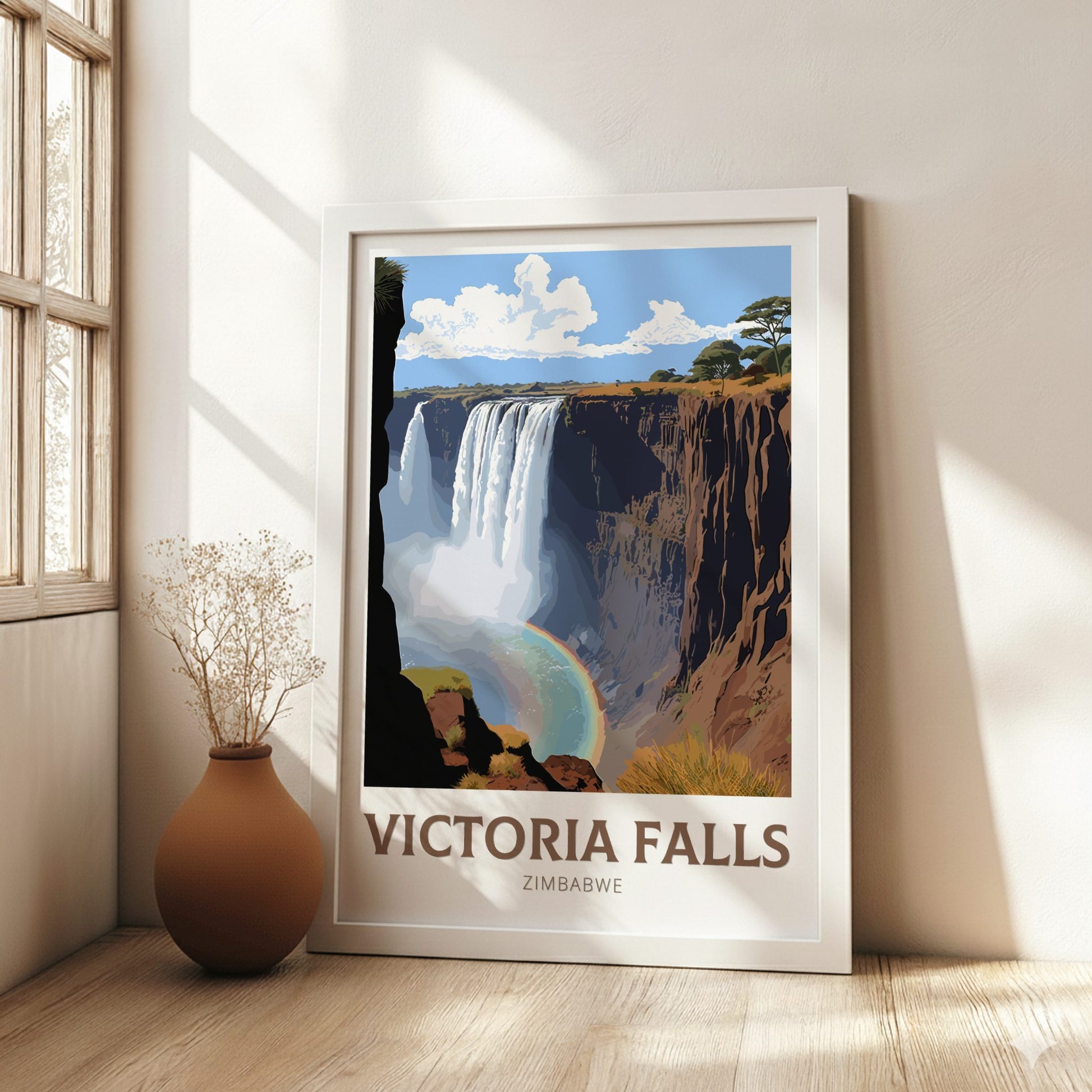 Framed poster of Victoria Falls in a room with a vase and window.