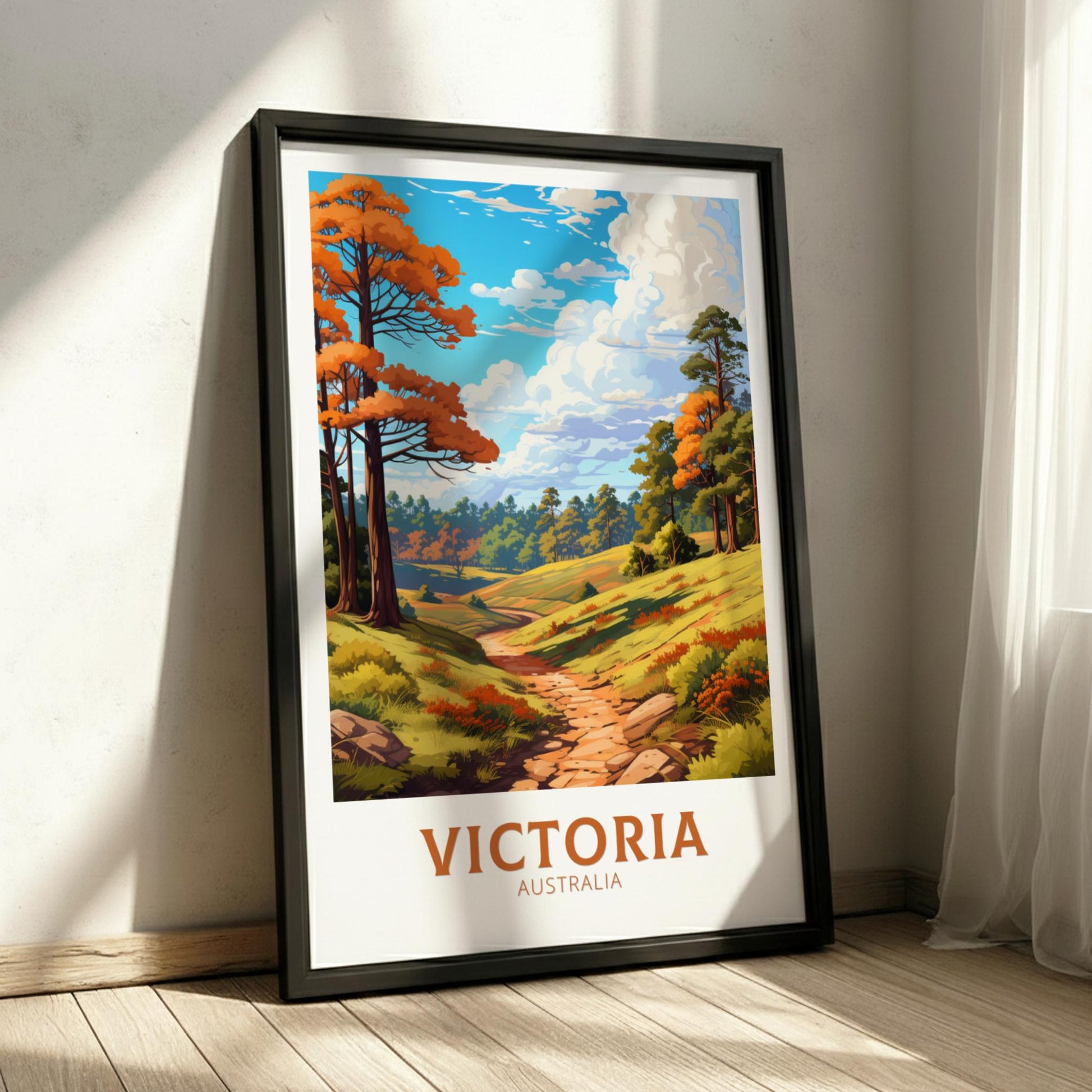 Framed artwork of a scenic landscape with trees and a path, labeled 'Victoria, Australia', on a wall.