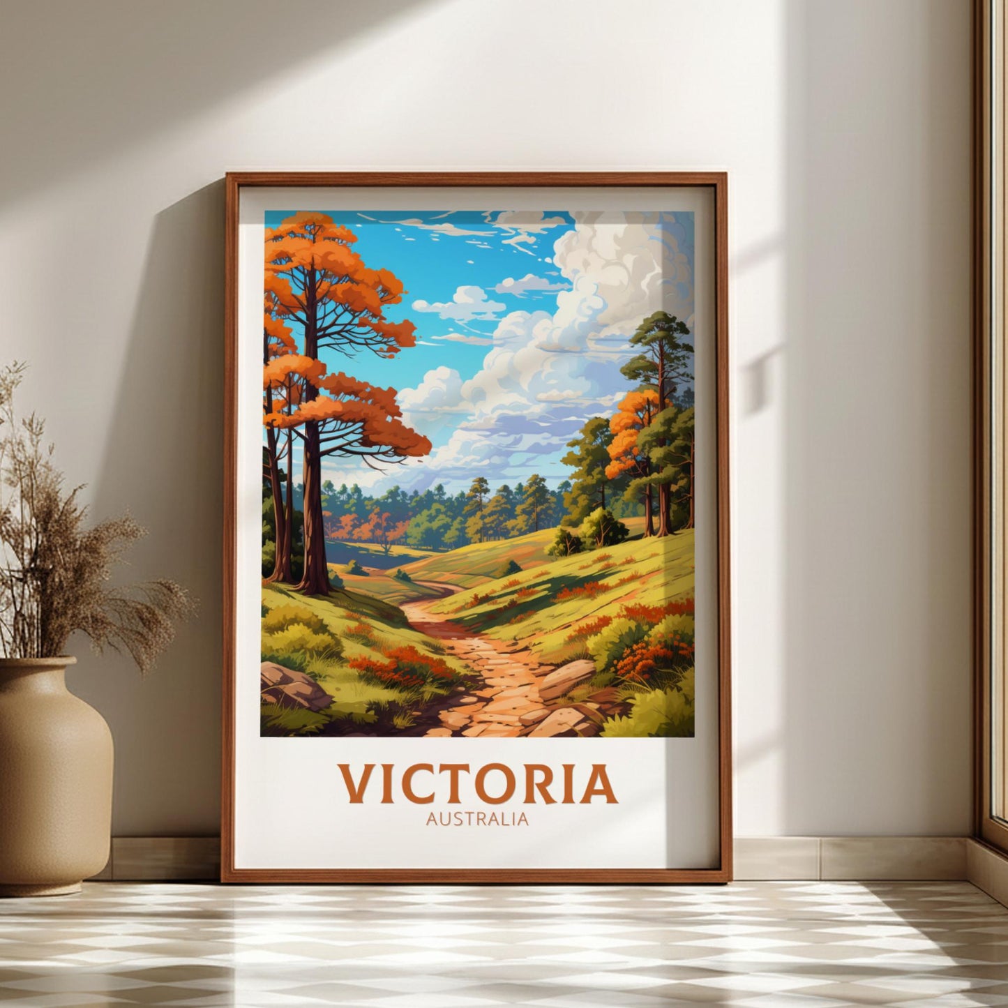 Framed artwork of a scenic landscape with trees and a path, labeled 'Victoria, Australia', on a wall.