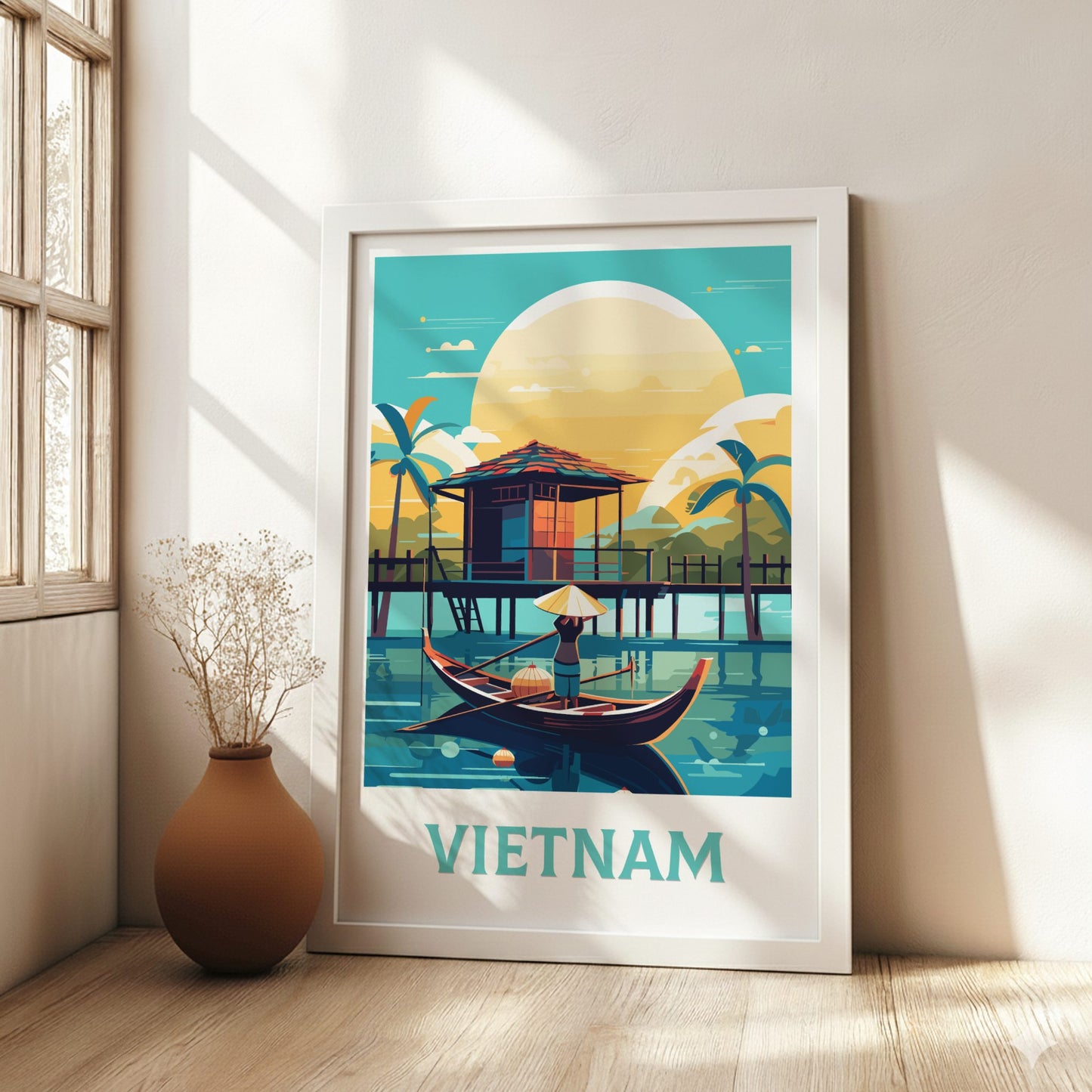 Framed artwork of Vietnam with a hut and boat on a lake, placed in a room with a vase and window.