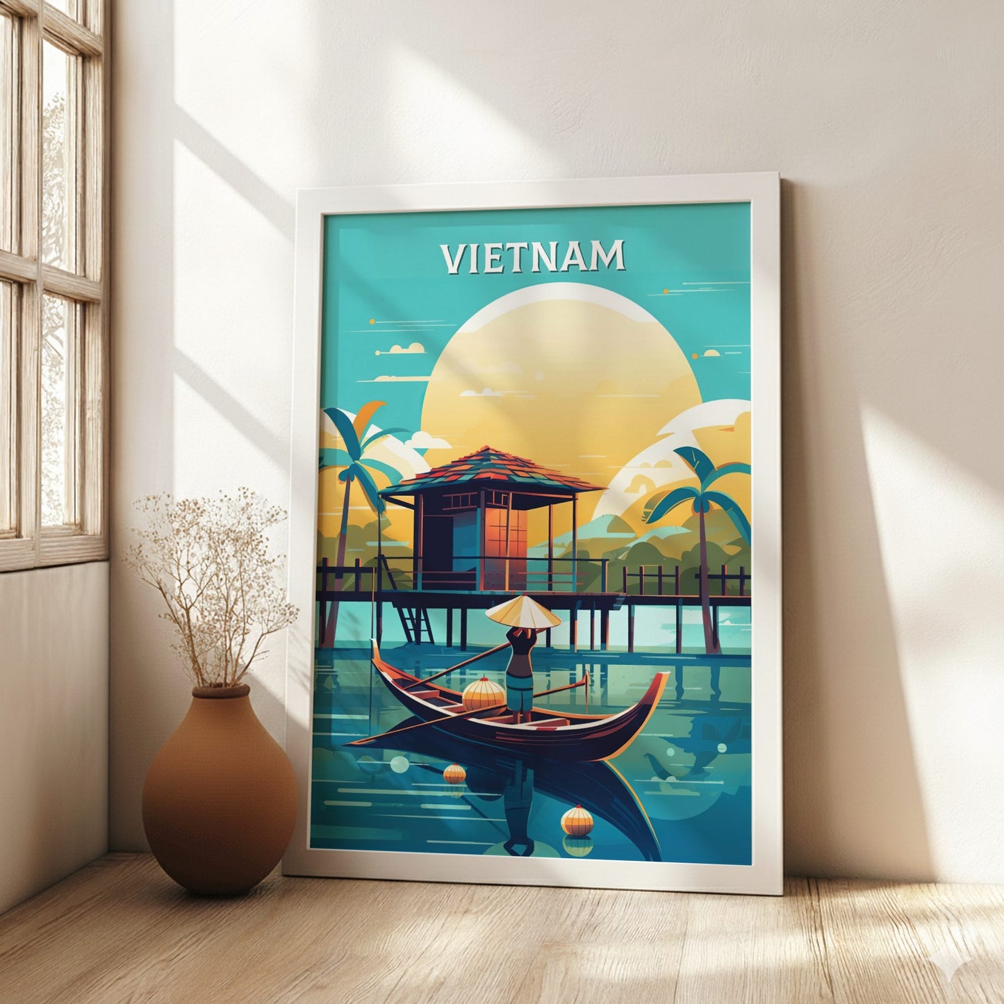 Framed artwork of Vietnam with a hut, boat, and sunset on a wall.