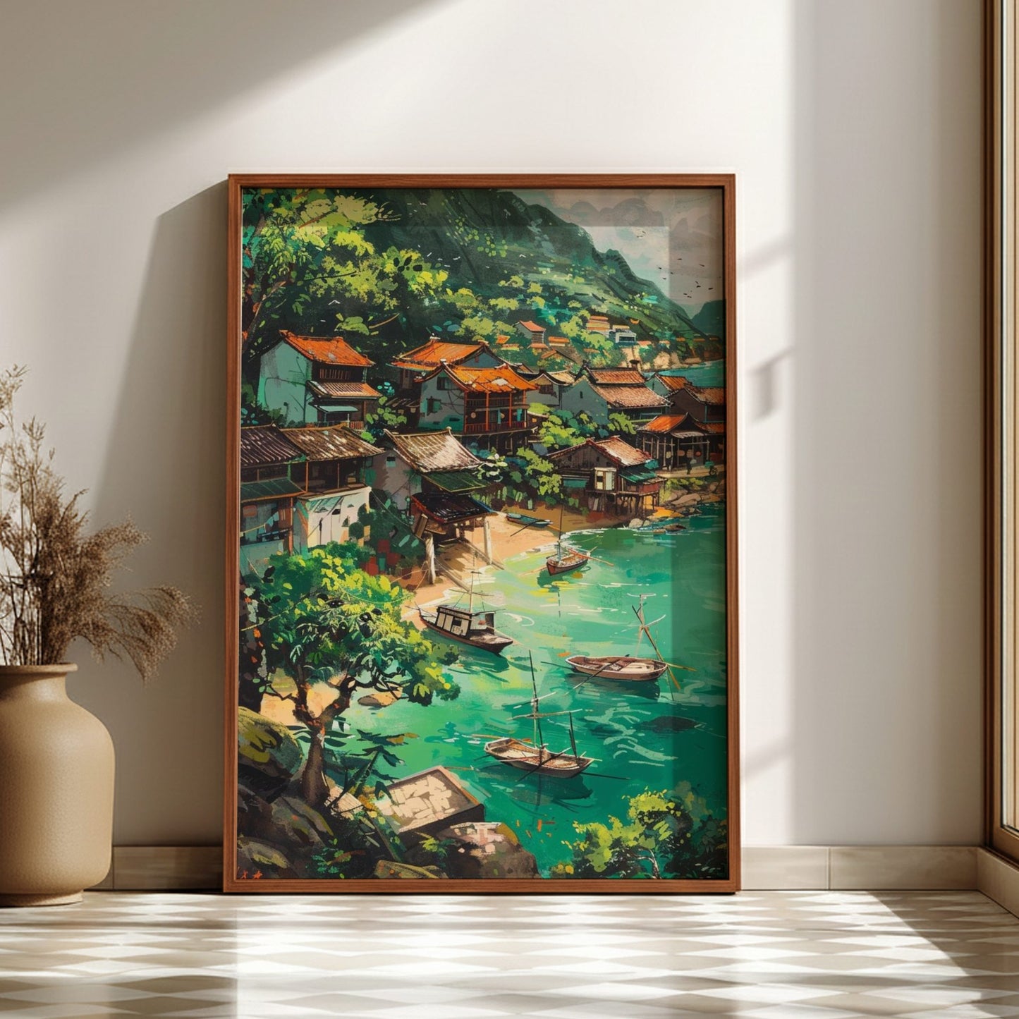 Framed painting of a scenic village by a lake in a room with a vase and plant.