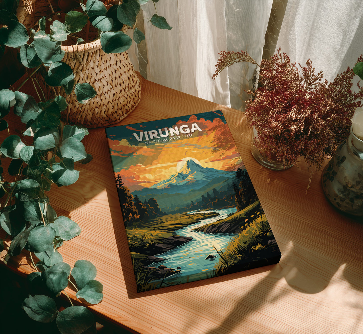 Book titled 'Virunga' on a wooden table with plants and decor